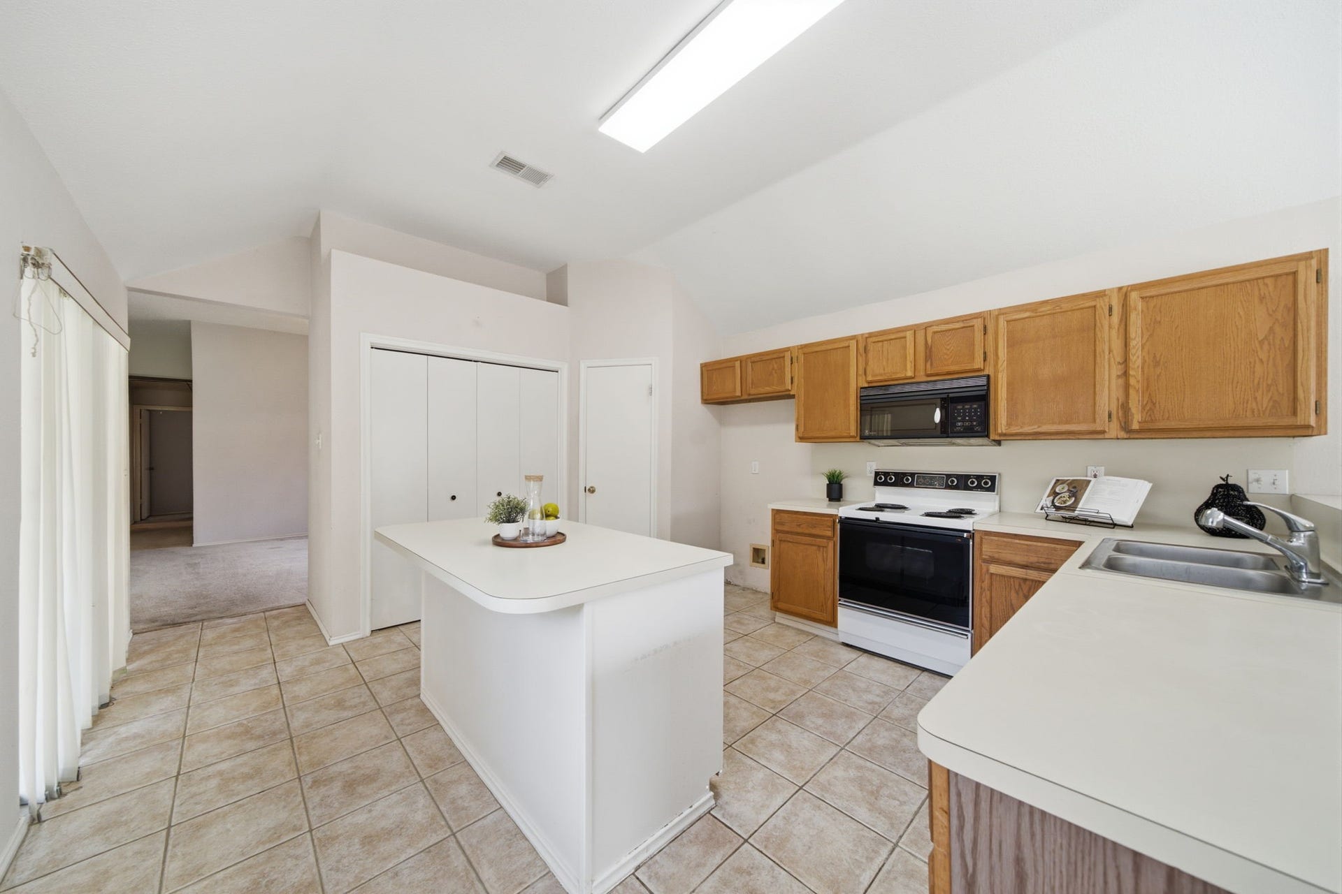 707 Laurel Grove Lane, Pearland, TX 77584 Island kitchen with breakfast bar seating.