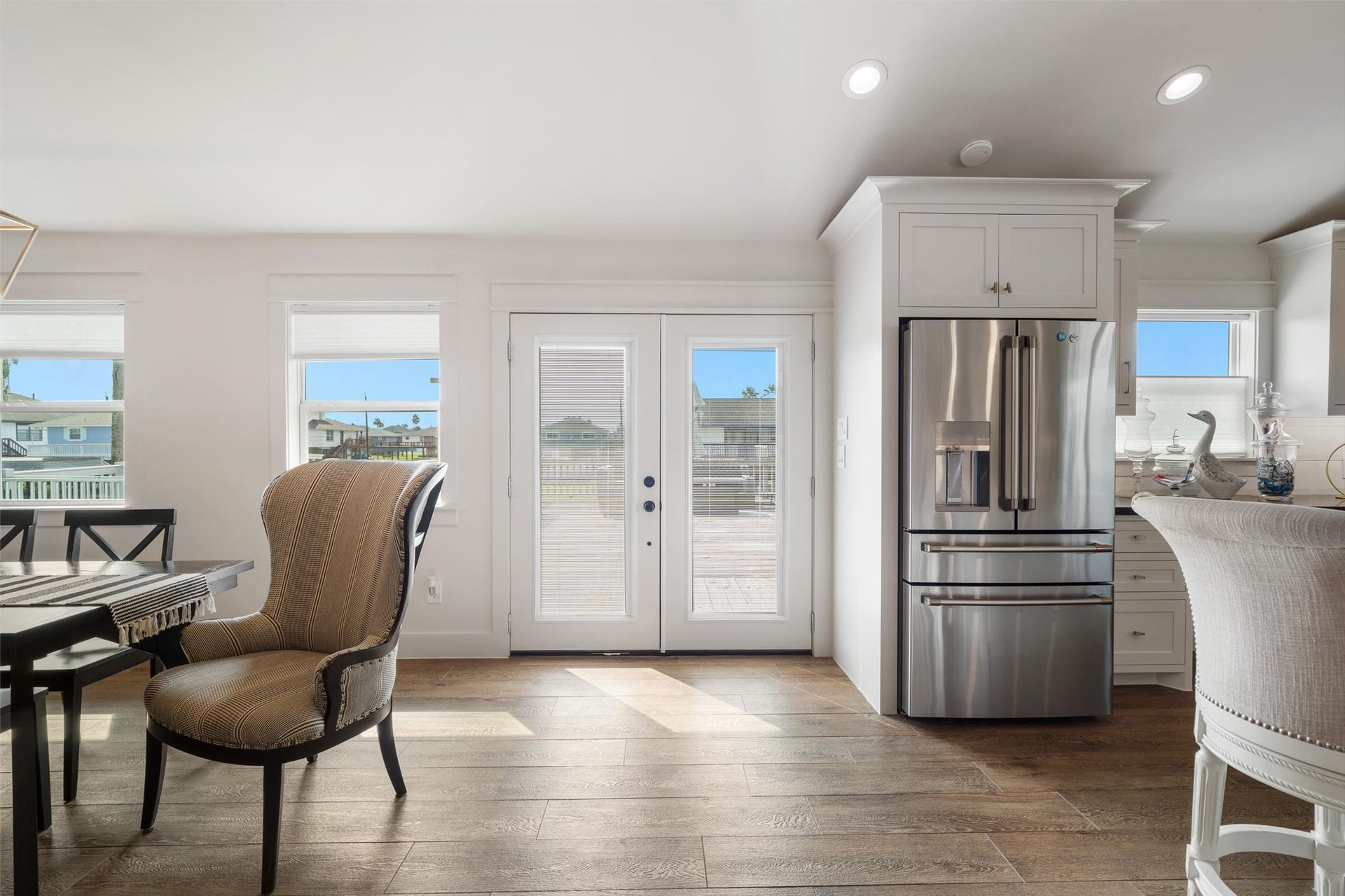 276 Barracuda Street, Bayou Vista, TX 77563 View as you enter the home, looking out towards the water side. Notice the stunning luxury vinyl plank flooring throughout the entire home