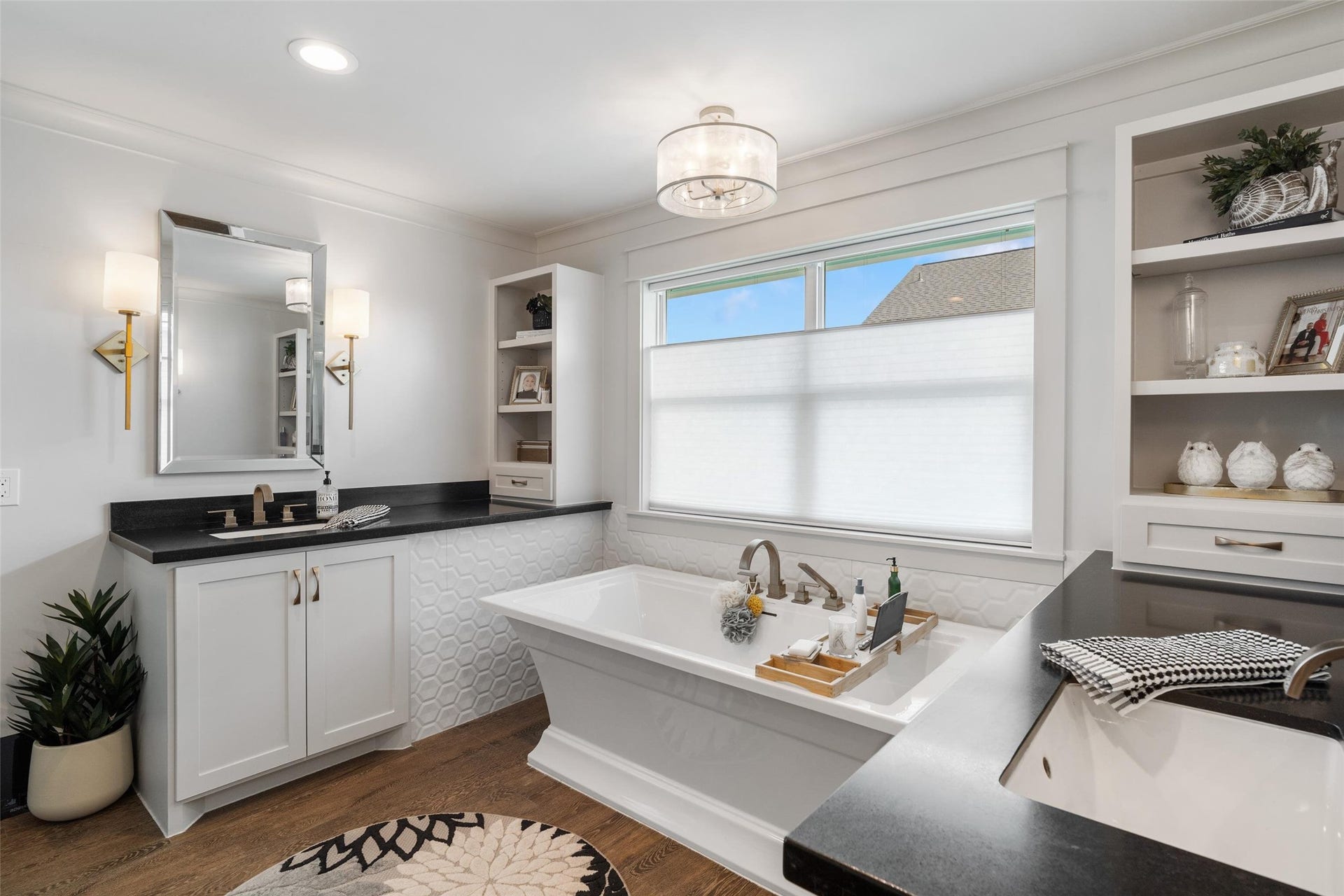 276 Barracuda Street, Bayou Vista, TX 77563 Elegant primary ensuite showcasing dual vanity areas with ample storage, a luxurious soaking tub for unwinding, and a beautifully designed layout that blends style with spa-like comfort