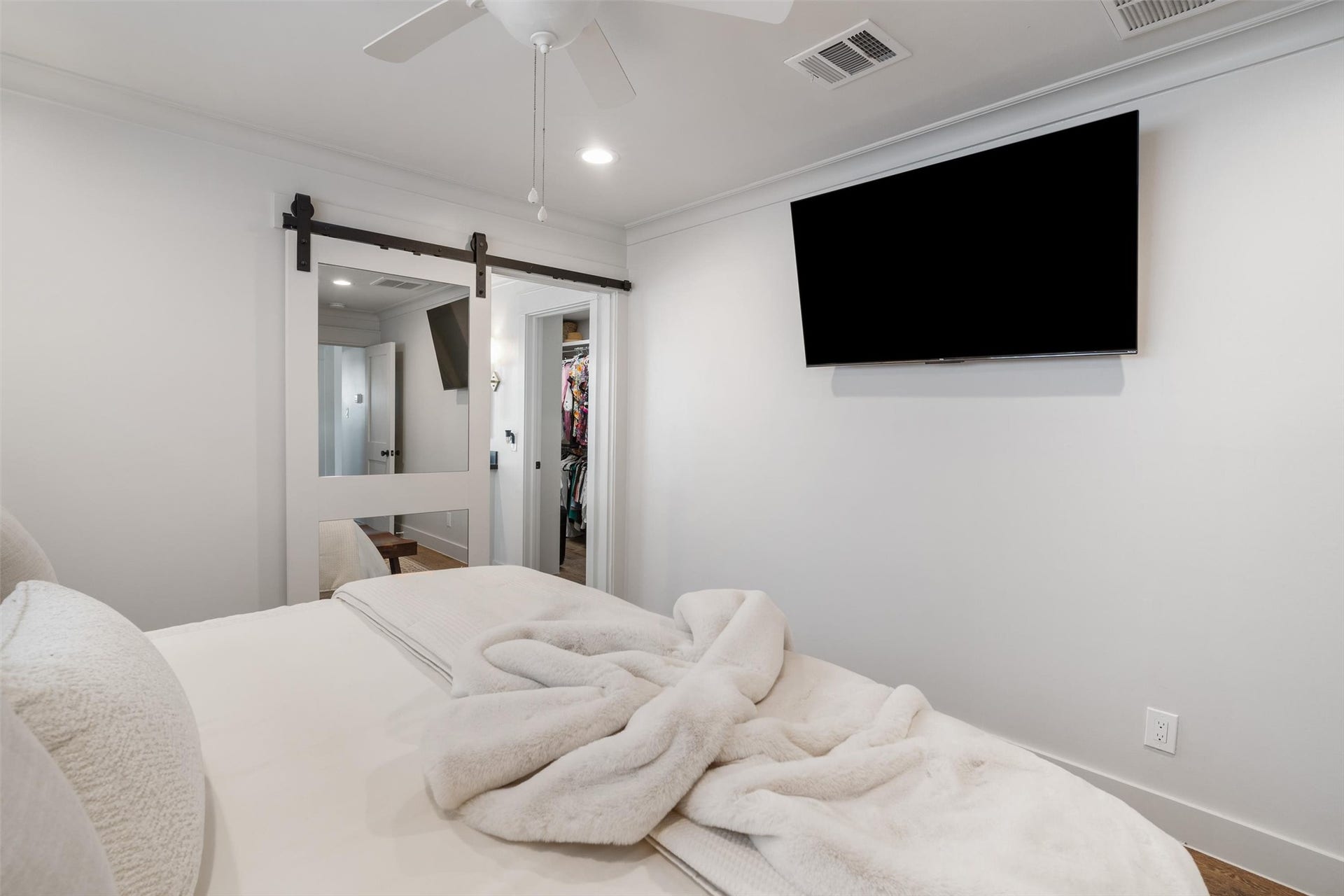 276 Barracuda Street, Bayou Vista, TX 77563 View of the modern sliding barn door into the walk in closet and primary ensuite