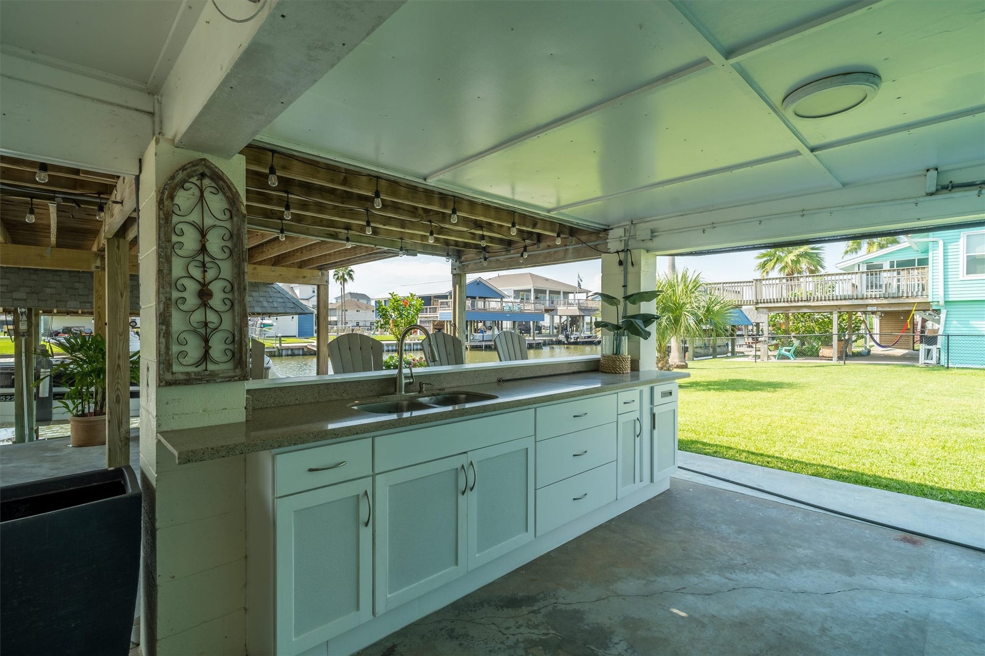 276 Barracuda Street, Bayou Vista, TX 77563 Downstairs features a built-in bar with a sink, creating the perfect spot to gather and share stories about the big one that got away after a day of fishing on the water.