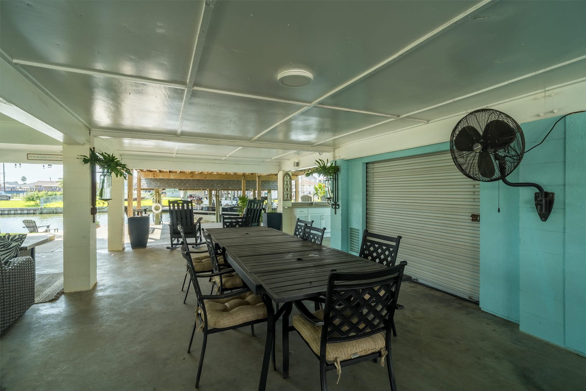 276 Barracuda Street, Bayou Vista, TX 77563 More downstairs entertaining area. Behind the small garage type door is a large storage room