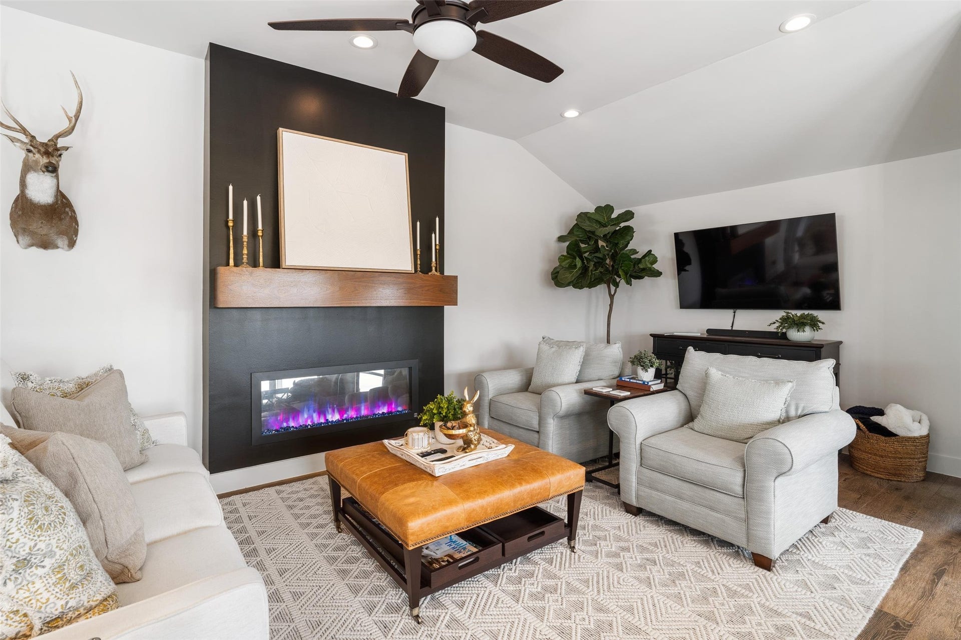 276 Barracuda Street, Bayou Vista, TX 77563 The electric fireplace is a show stopper in the living area. The ceiling height is very noticeable in this picture. Raising the ceiling height is one of the many updates the sellers added