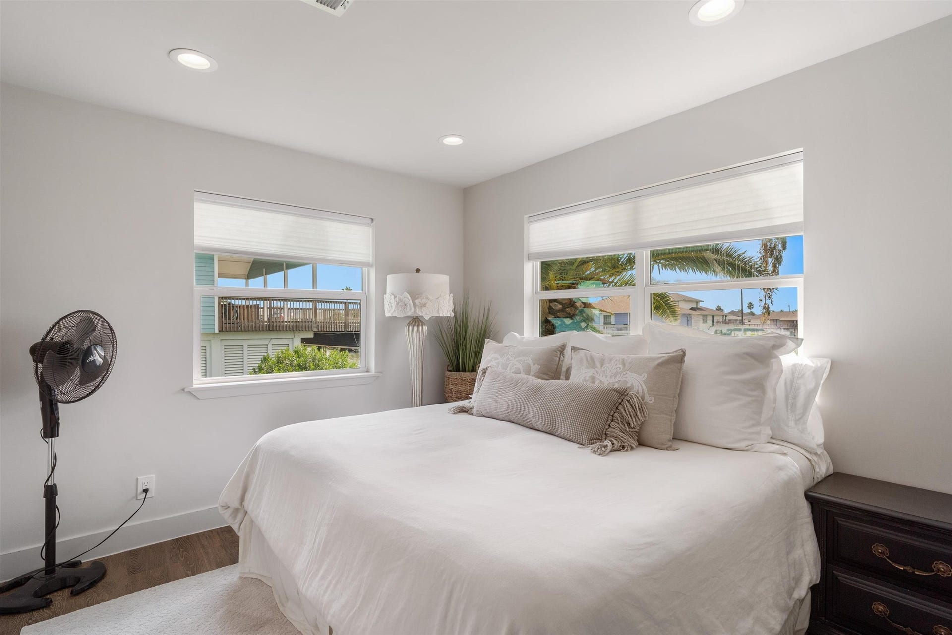 276 Barracuda Street, Bayou Vista, TX 77563 Bright guest bedroom on the water side of the home features stunning views, abundant natural light, and soothing dcor
