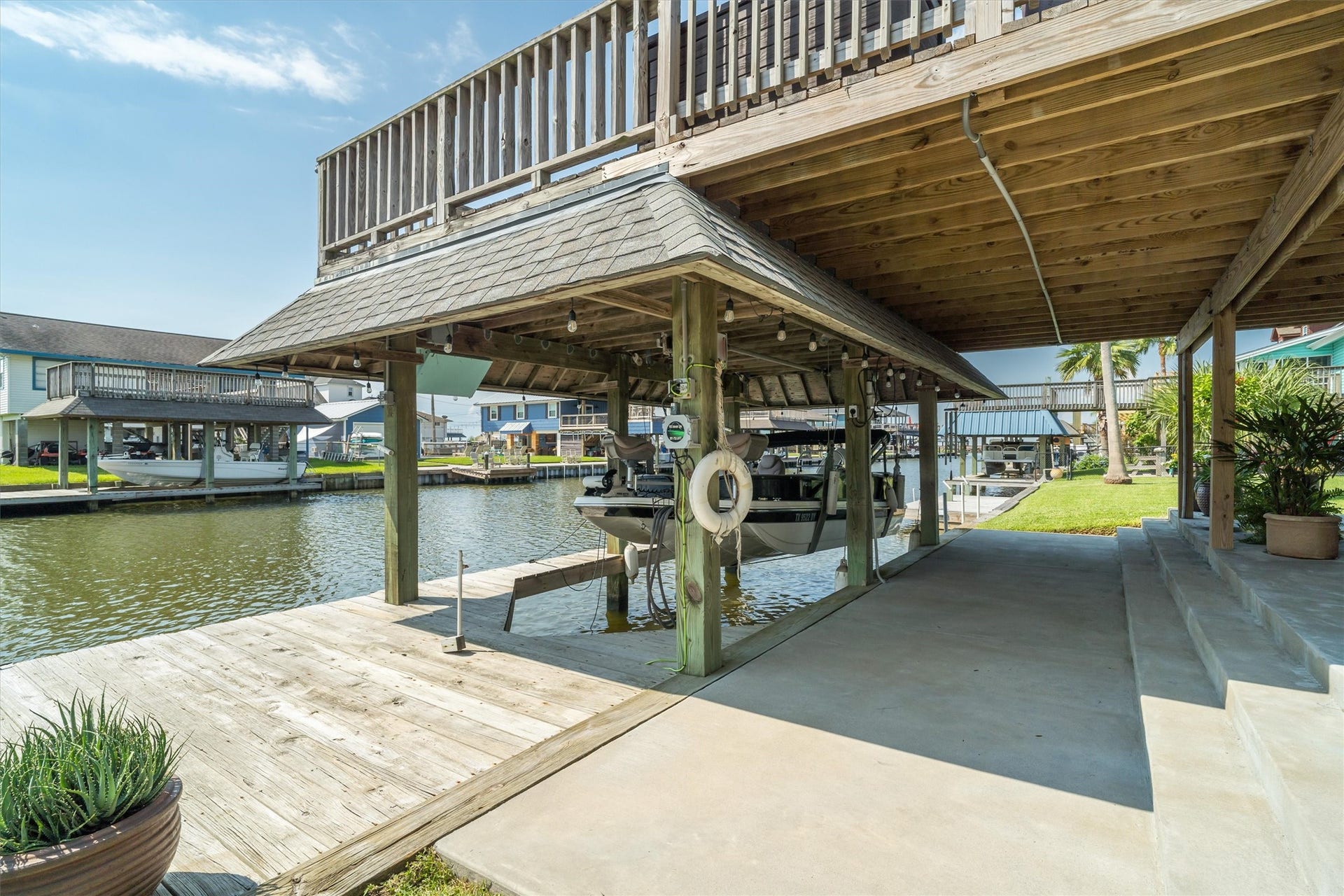 276 Barracuda Street, Bayou Vista, TX 77563 Enjoy the convenience of your very own boathouse and boat slipglide in after a day on the water and park with ease. Setting out for fishing, cruising, or adventure is simple and effortless, right from your own yard