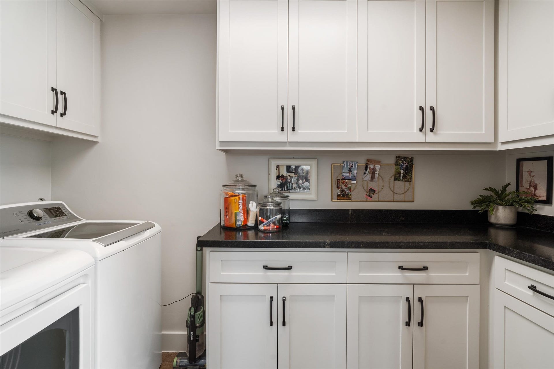 276 Barracuda Street, Bayou Vista, TX 77563 Upstairs, a spacious laundry room offers built-in storage, providing plenty of space and convenience for all your laundry needs