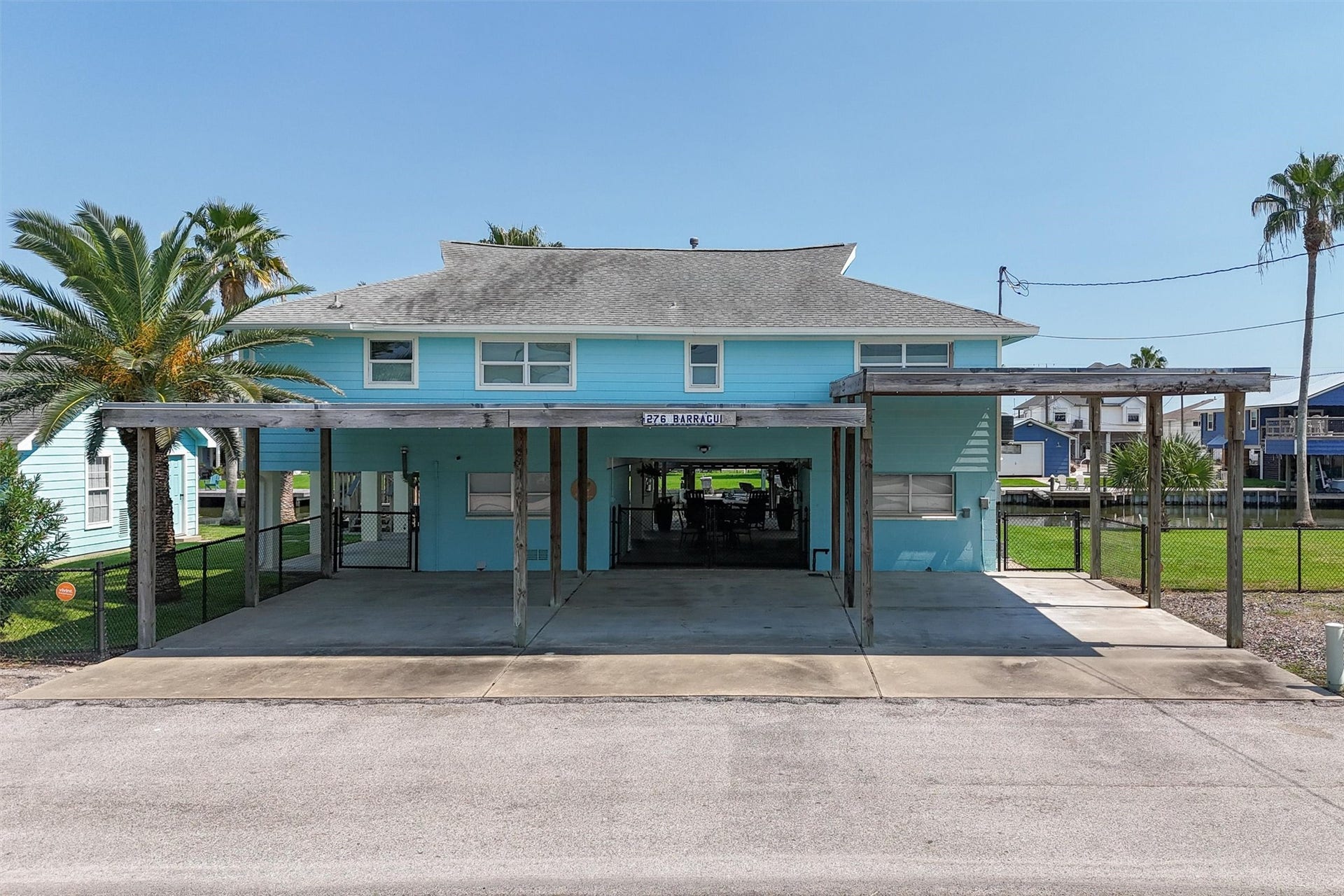276 Barracuda Street, Bayou Vista, TX 77563 This home offers exceptional parking options with an attached garage, a convenient carport, and a dedicated RV carportperfect for all your vehicles, guests, and outdoor adventures