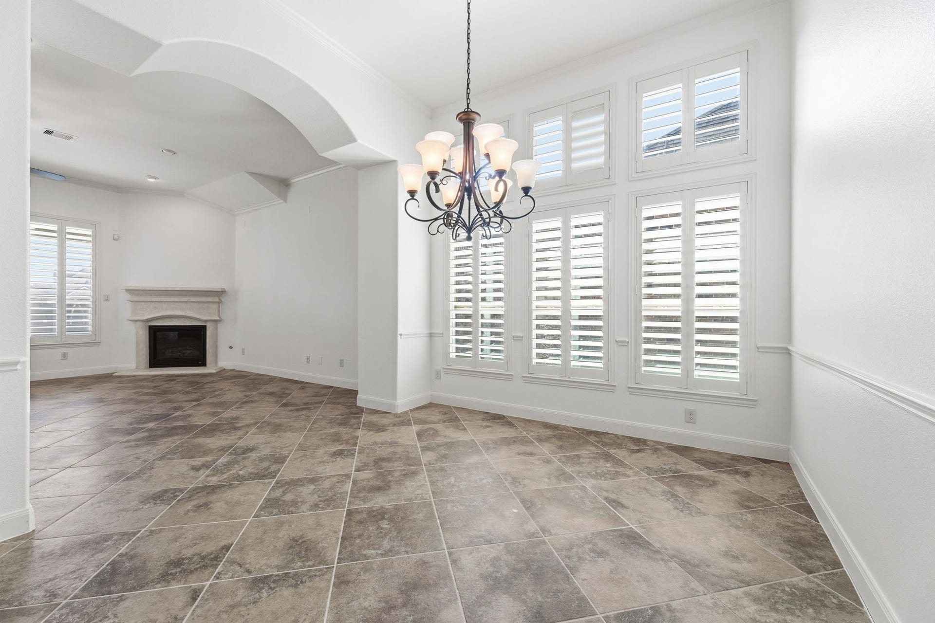 Formal dining room with large windows and abundant natural light. Perfect for hosting that upcoming Christmas party.