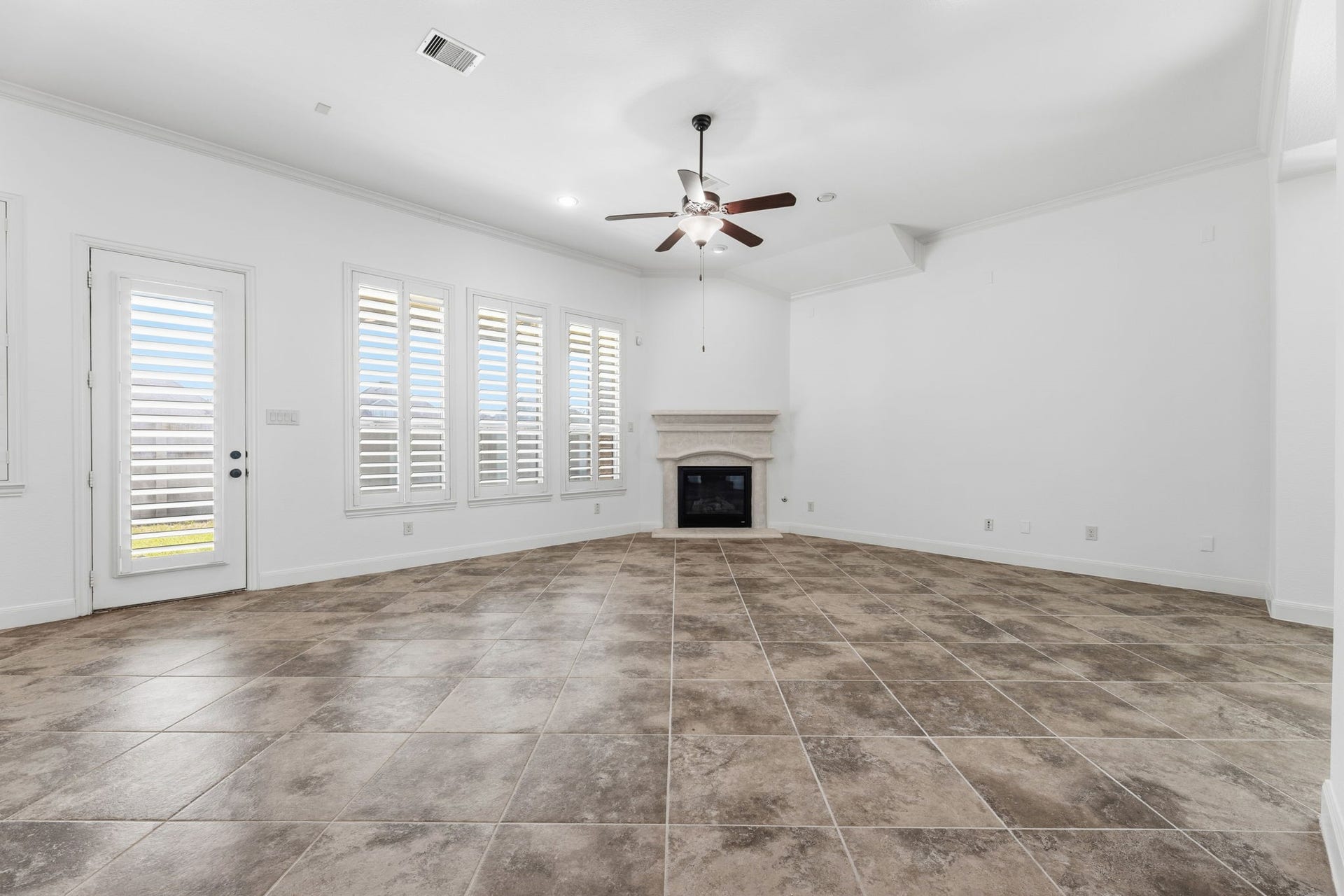 Living room, featuring a gas log fireplace.
