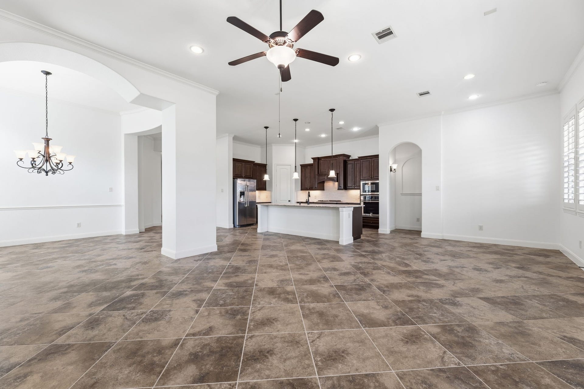 Living room that flows to the modern kitchen.