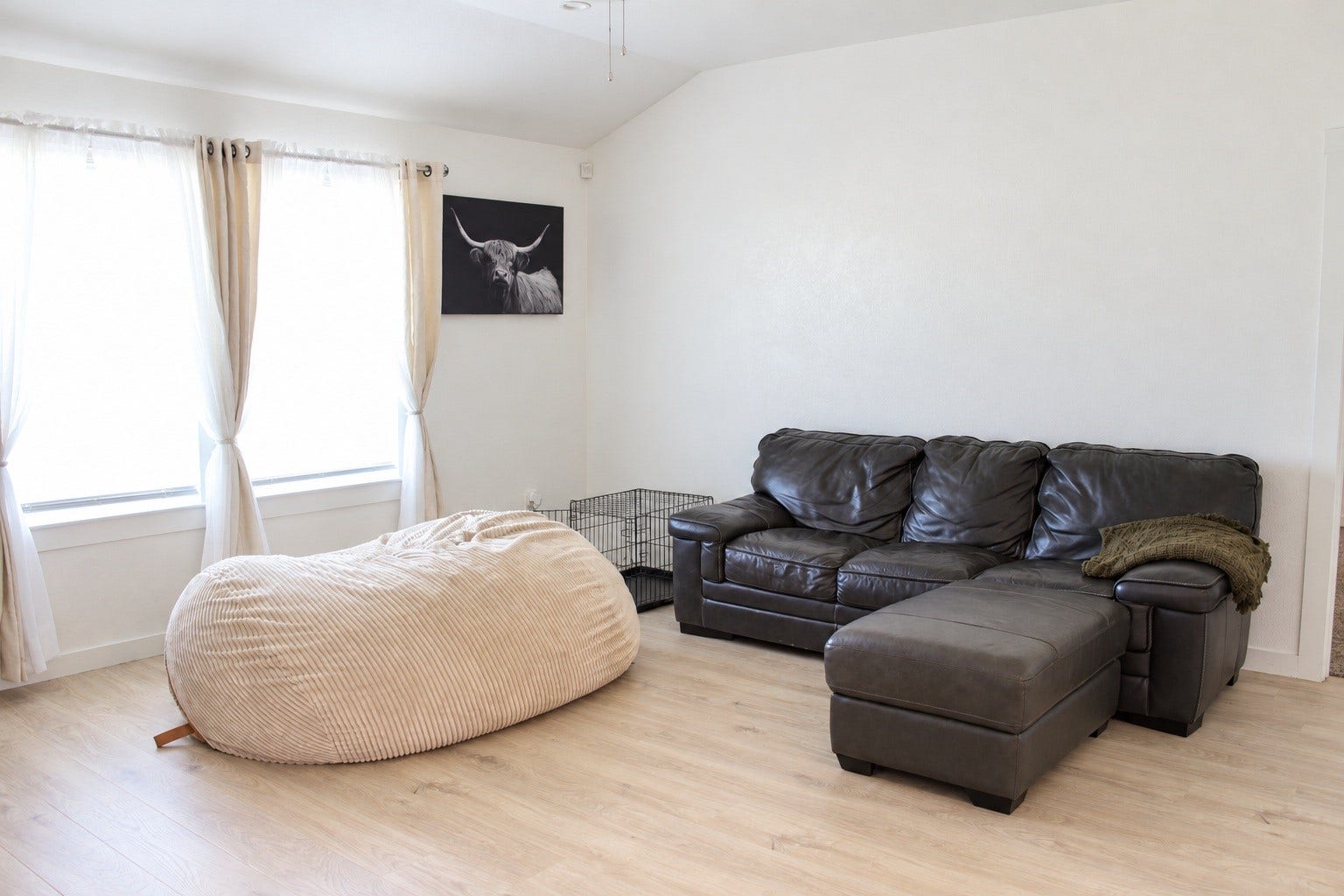Living Room with Natural Light, and Wood-Look Flooring.