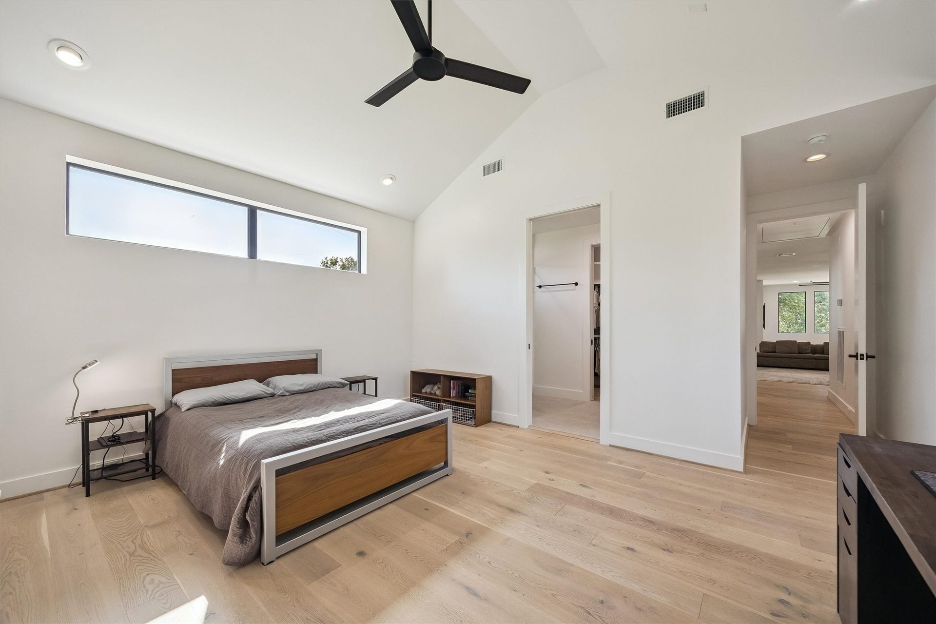 5210 Manor Drive, Sugar Land, TX 77479 Vaulted ceilings, contemporary finishes, and thoughtfully positioned windows create an airy, welcoming bedroom designed for restful nights and quiet moments.