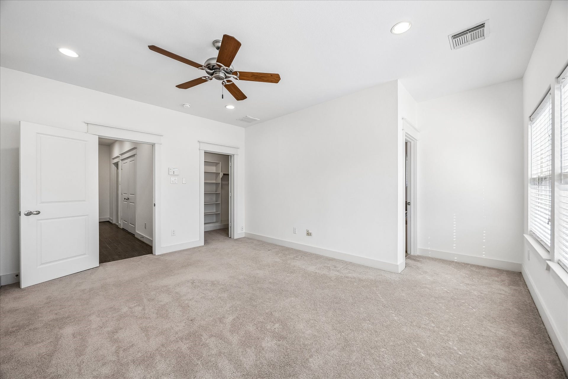 The primary bedroom features a walk-in closet and fully outfitted bathroom