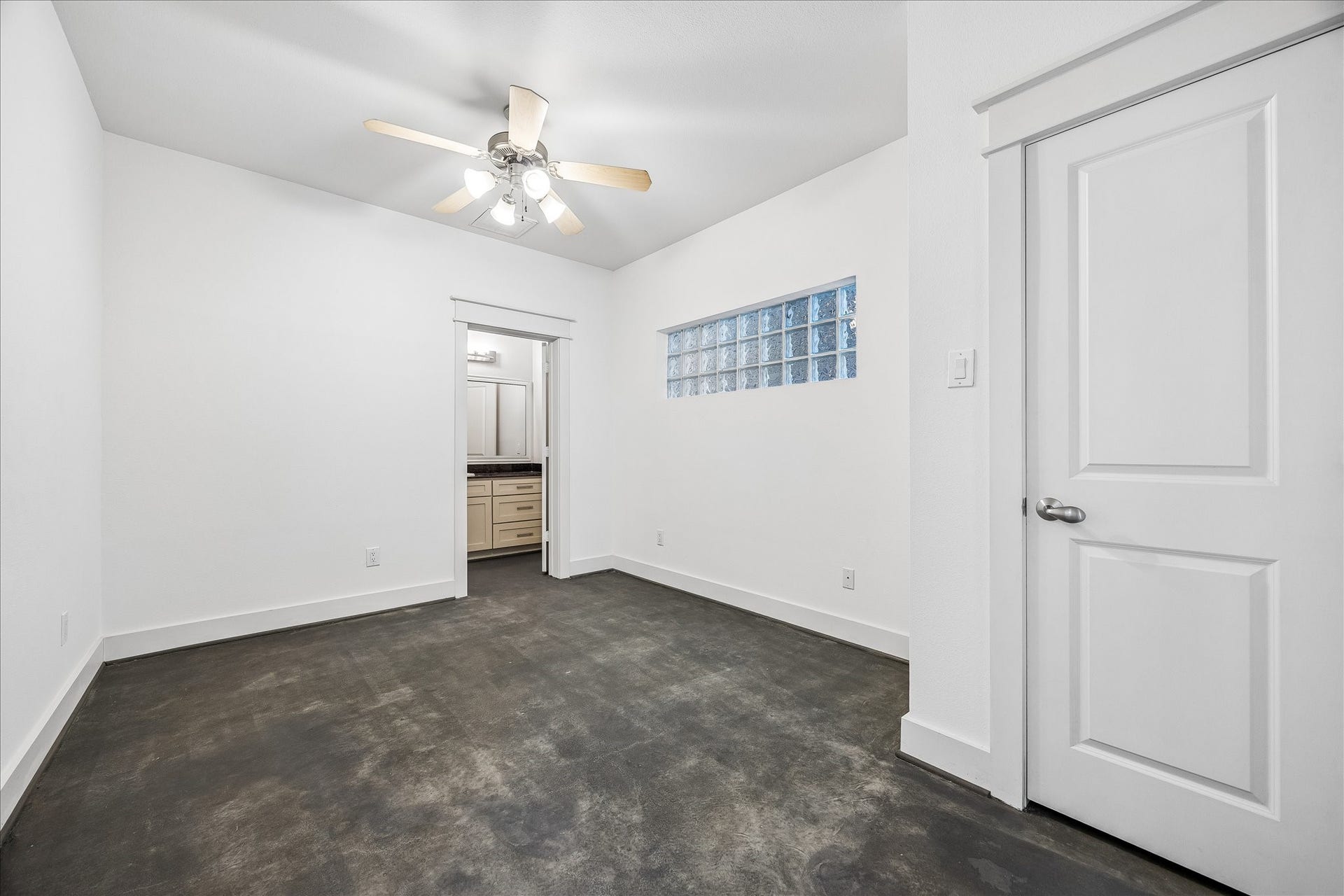 The first floor bedroom features a closet, ensuite bath, and private entry from the yard - perfect for roommates, a guest, or an office