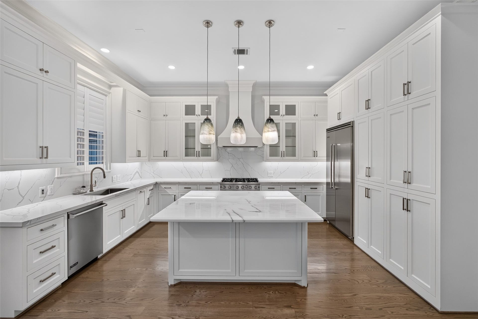 All Viking appliances and under cabinet lighting.  Power strips are located under the cabinets. Elegant pendants over the large island.