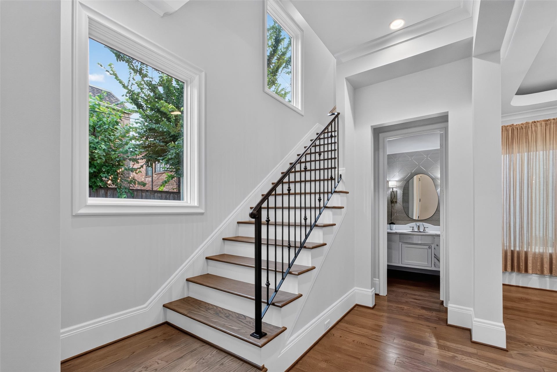 On the way to the second floor where the primary bedroom, laundry room and 2 secondary bedrooms are located