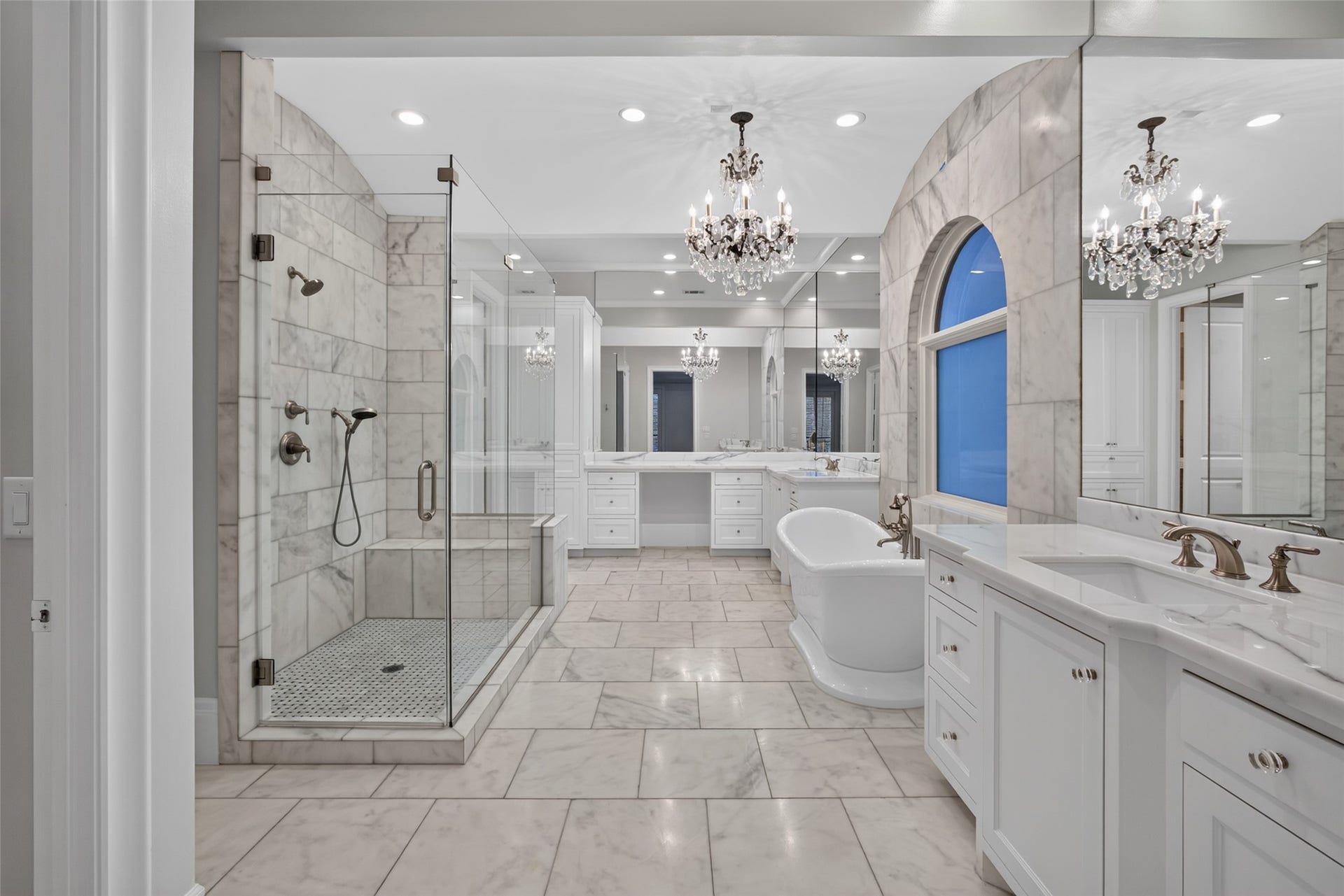 Large shower with built-in seat or a soaking tub? You choose.