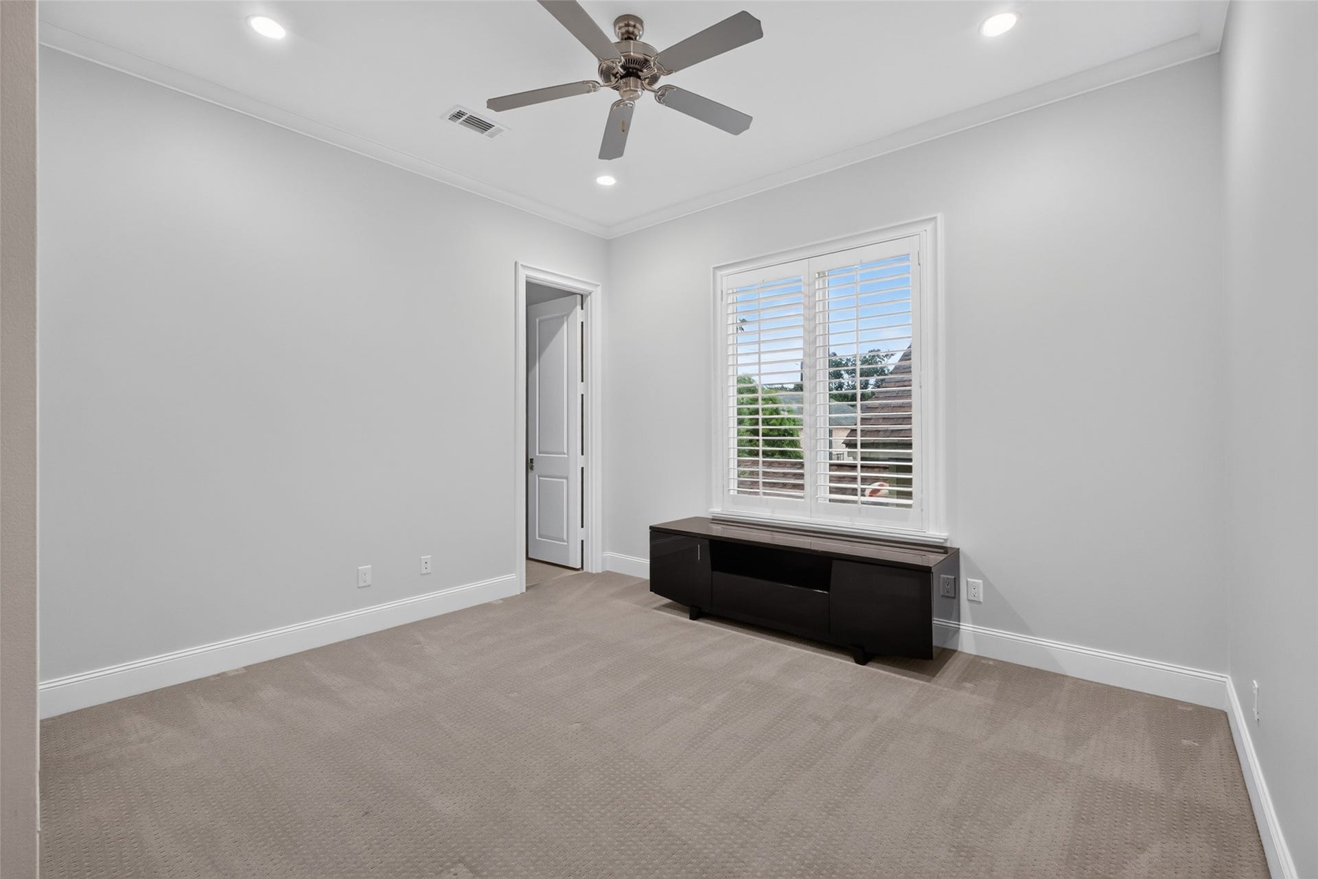 Third bedroom with a TV stand that conveys