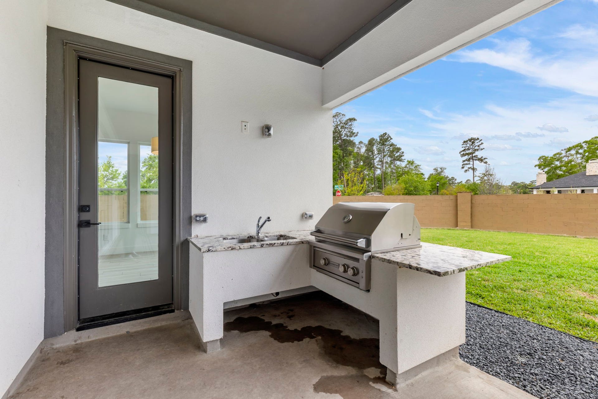 24739 Trull Brook Lane, Spring, TX 77389 Outside grill and sink with granite countertops.