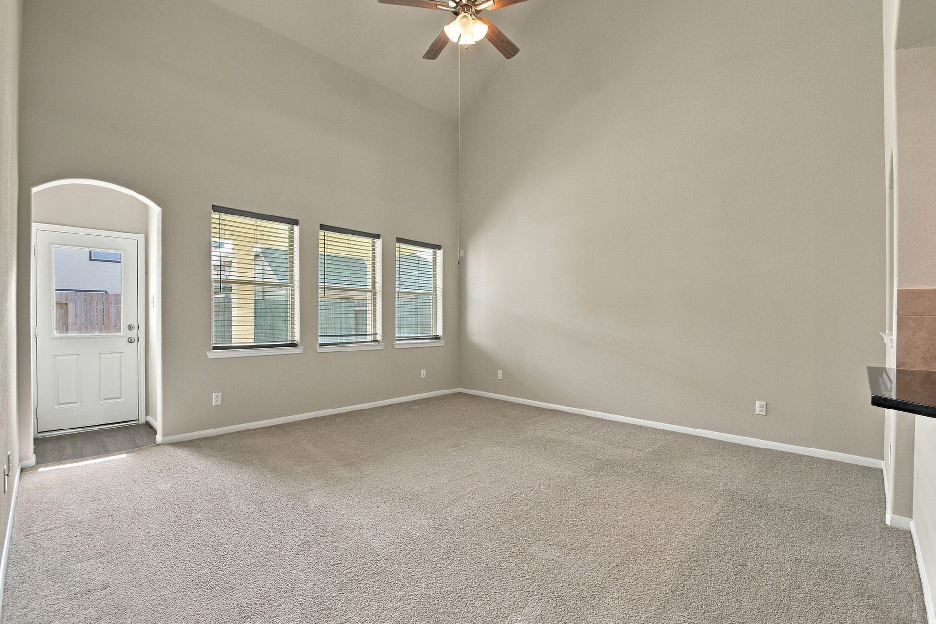 10423 Rochester Hills Lane, Tomball, TX 77375 Living Room looks out to the backyard