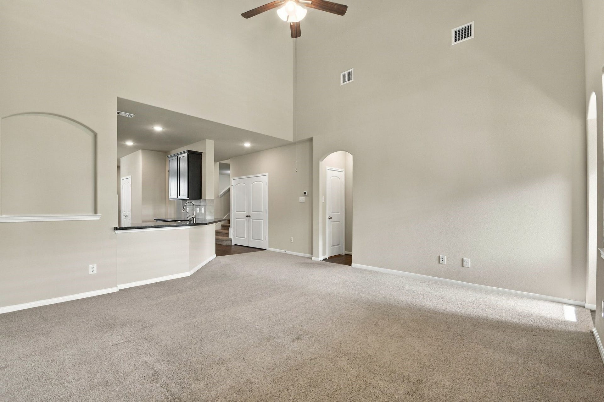 10423 Rochester Hills Lane, Tomball, TX 77375 Living Room features tall ceilings and a fan
