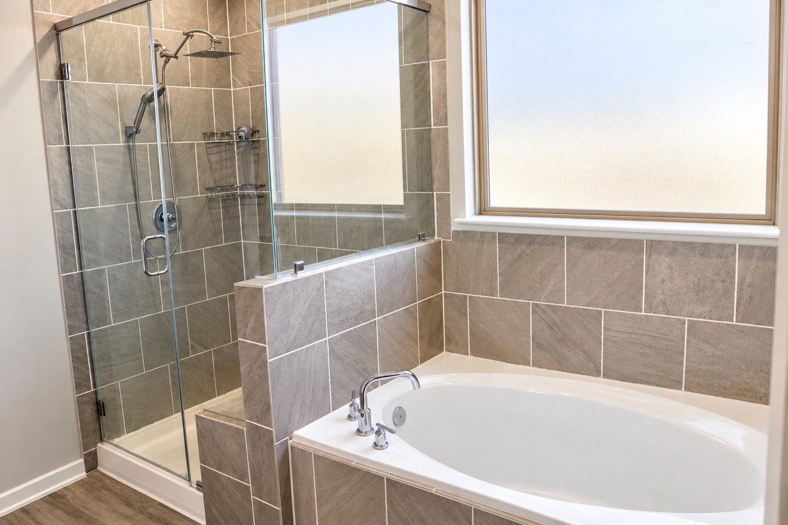 1007 Rosewood Trail, Beasley, TX 77417 Primary bath featuring a separate soaking tub and spacious walk-in shower with glass enclosure, attractive tilework, and a window providing natural light.