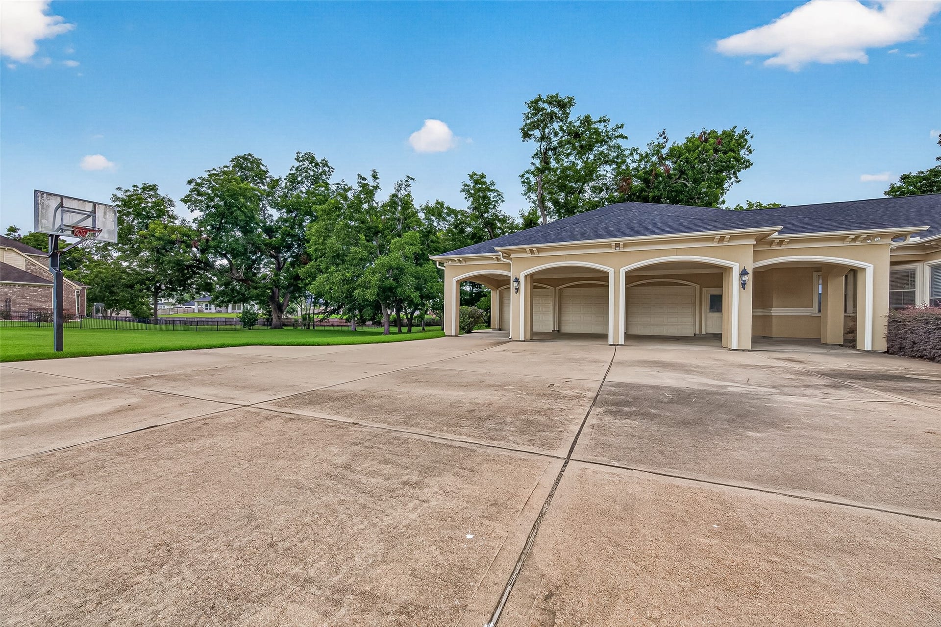 4011 Westerdale Drive, Fulshear, TX 77441 A sweeping, quadruple-wide porte-cochre and drive create a stately approach, beautifully framing the three-car garage and enhancing the homes commanding presence.
