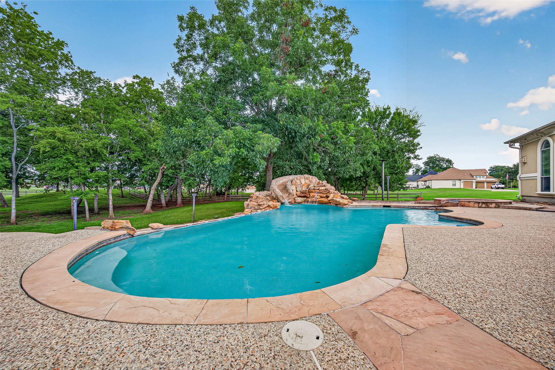 4011 Westerdale Drive, Fulshear, TX 77441 The jewel of the backyard is the infinity pool.