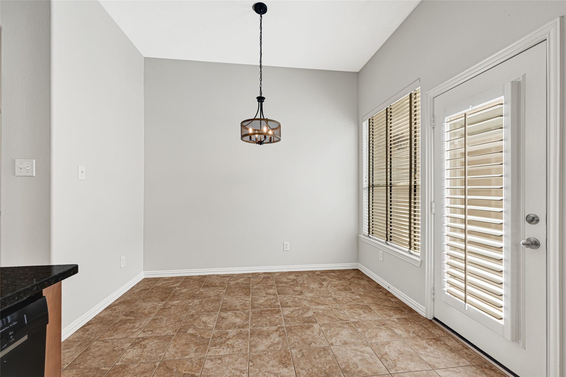 2910 Crescent Oaks Park Lane, Spring, TX 77386 Breakfast room with door leading to patio. Perfect for grilling.