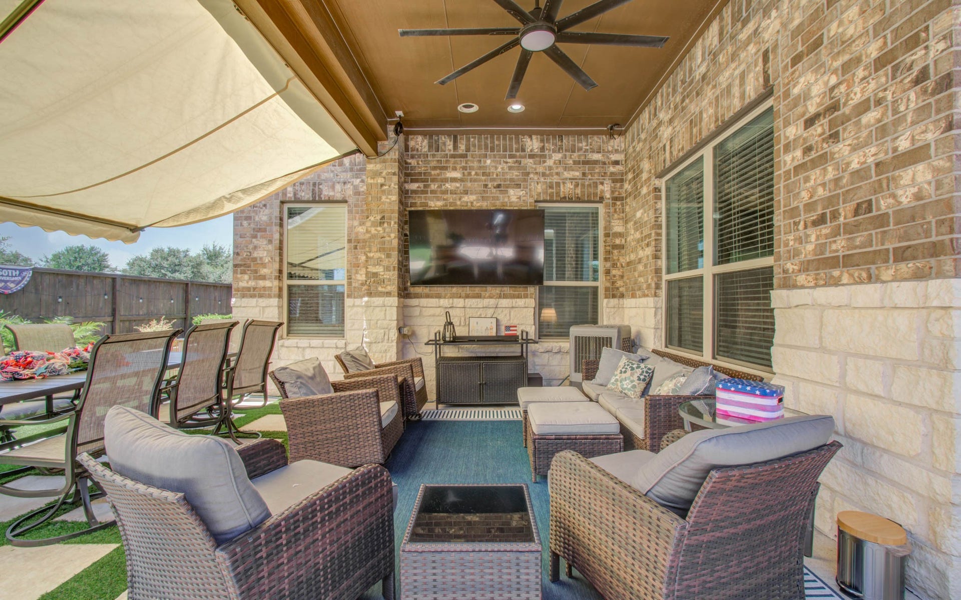 17915 Olde Oaks Estate Court, Cypress, TX 77433 Enjoy outdoor living with no back neighbors, a large, covered patio with retractable awning & large patio fan.