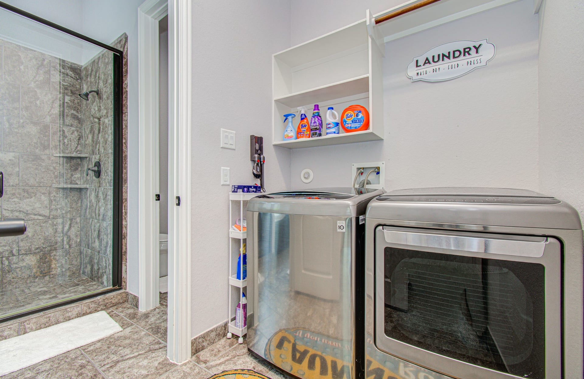 17915 Olde Oaks Estate Court, Cypress, TX 77433 Laundry room connects to primary bathroom for convenient laundry.