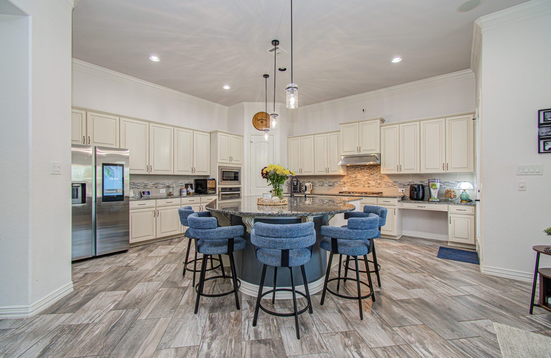 17915 Olde Oaks Estate Court, Cypress, TX 77433 The spacious kitchen features abundant cabinet space, granite counters & a large island.