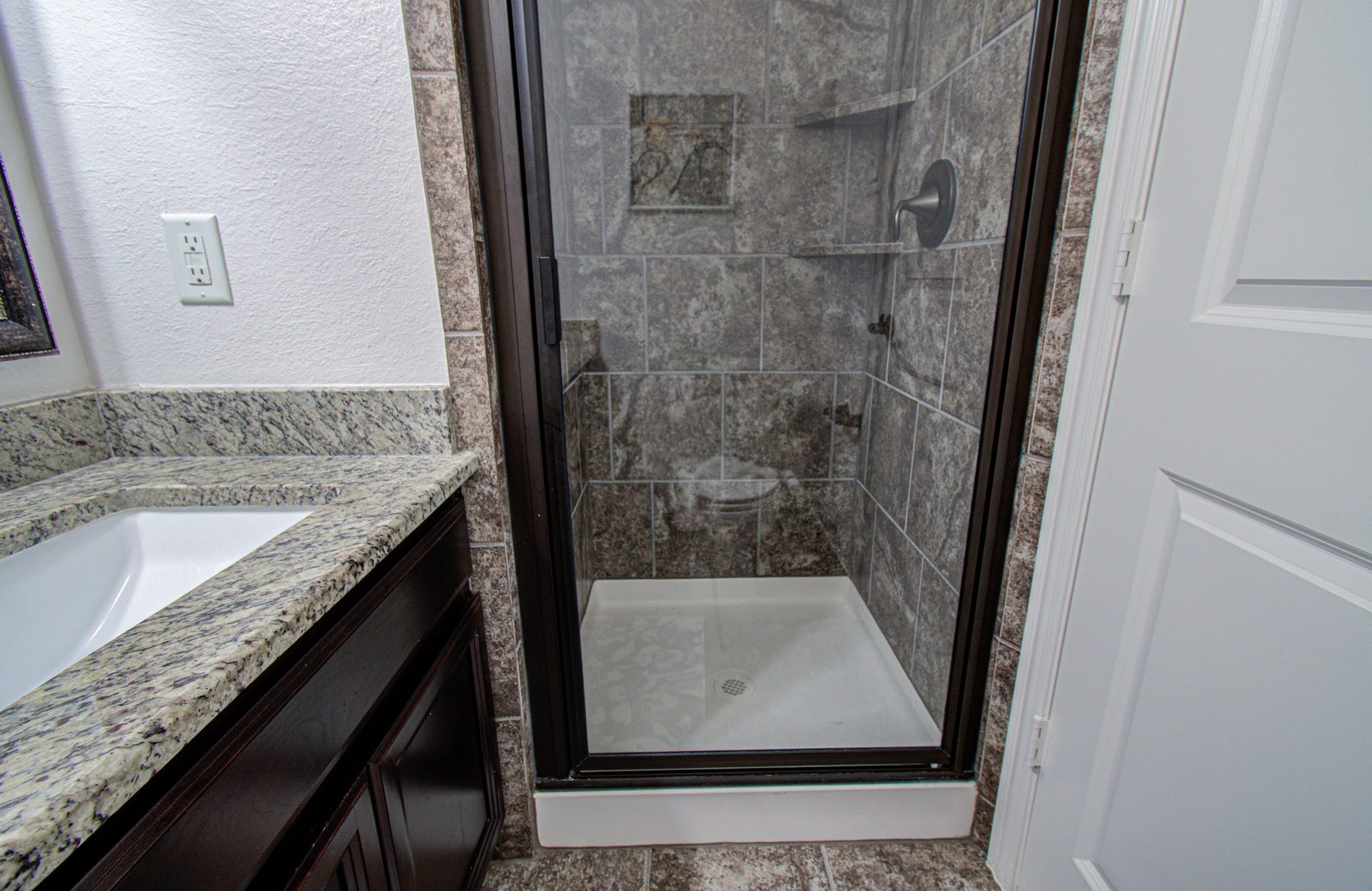 17915 Olde Oaks Estate Court, Cypress, TX 77433 2nd bathroom features granite counter, undermount sink and a walk in shower.