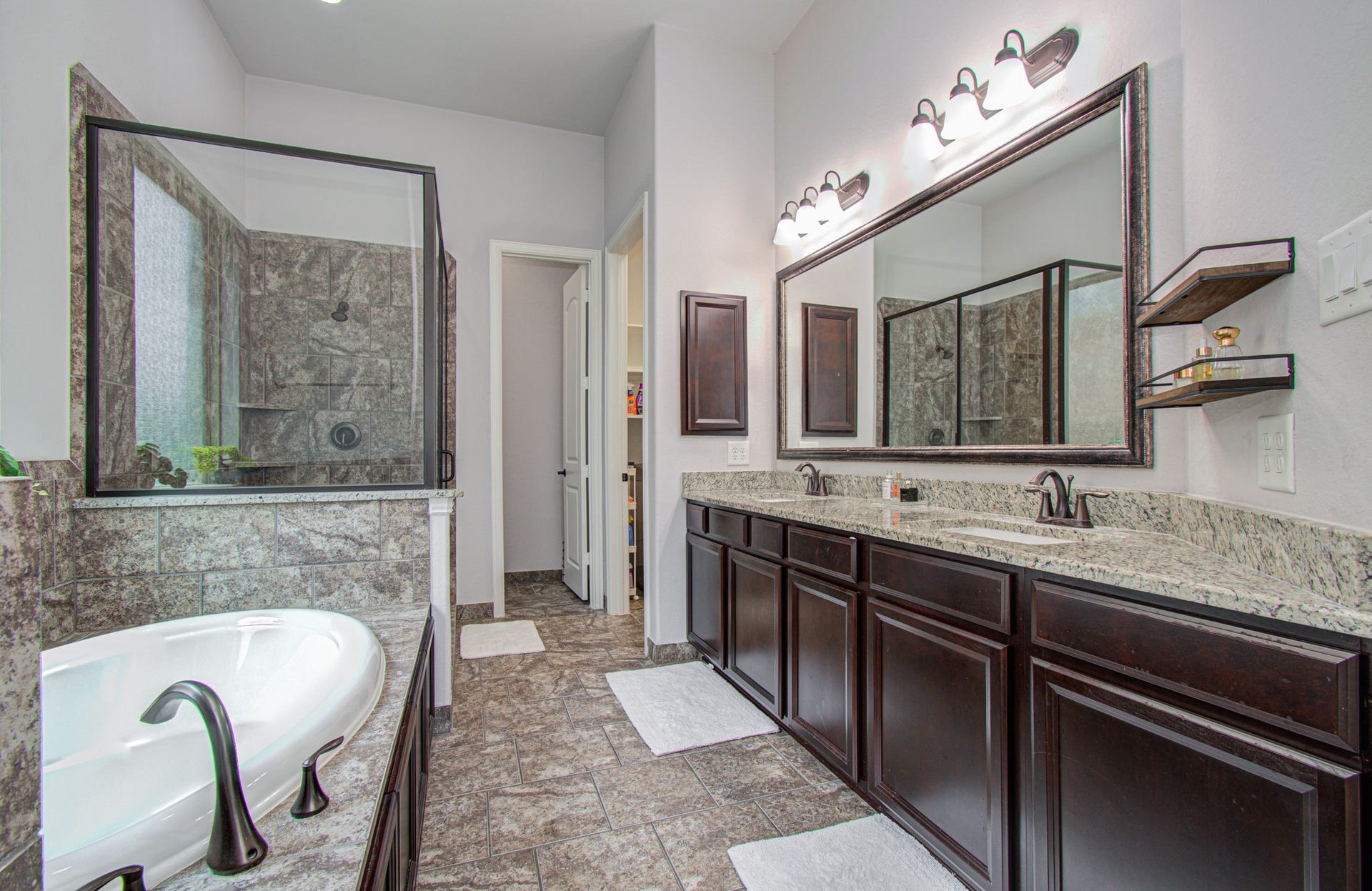 17915 Olde Oaks Estate Court, Cypress, TX 77433 Primary Bathroom features granite counters, dual undermount sinks, a soaking tub and a walk in shower.