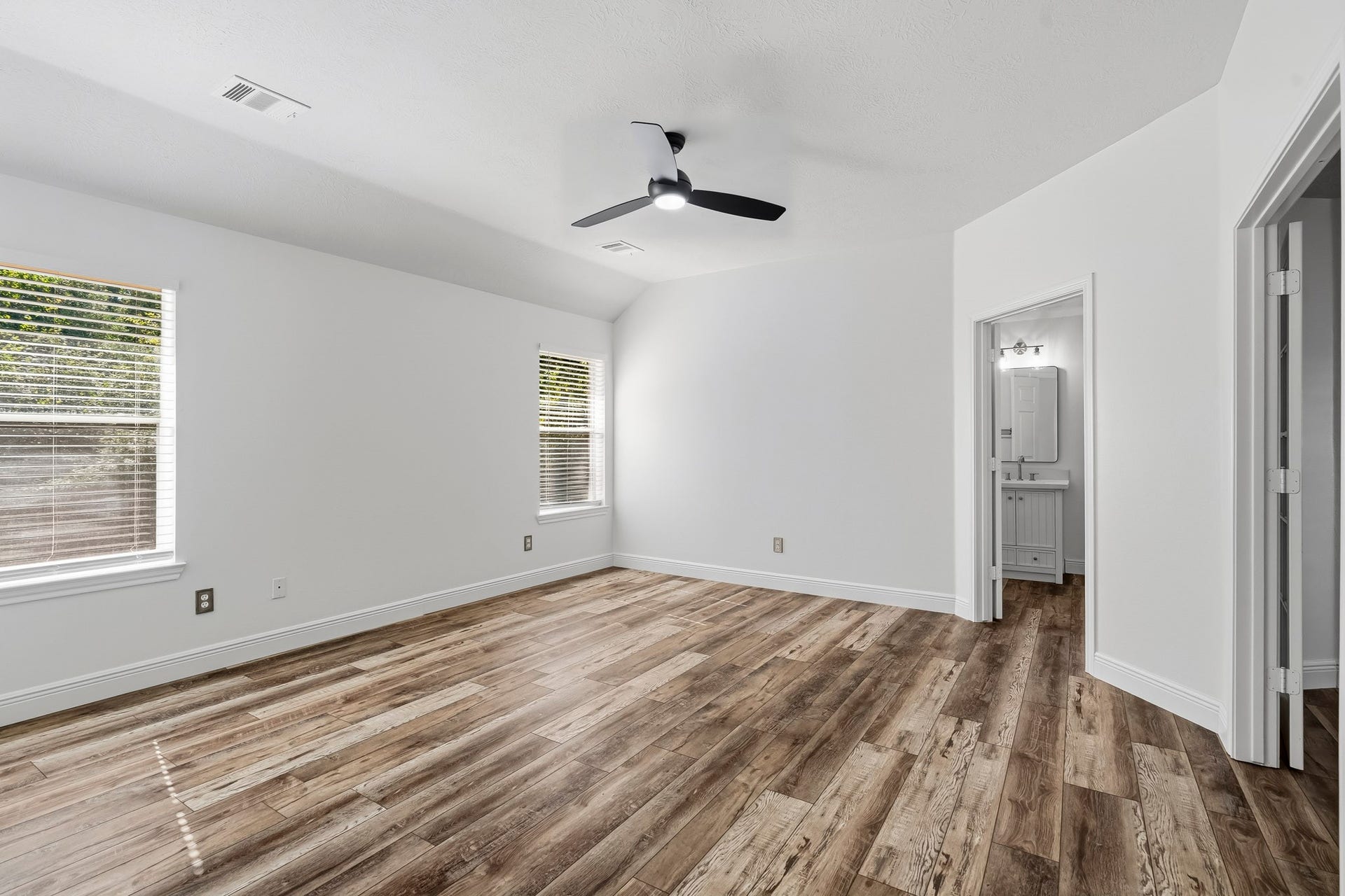3622 Pedernales Trails Lane, Katy, TX 77450 Spacious and bright primary bedroom with large windows, built in shelves, fresh paint and attached flex room