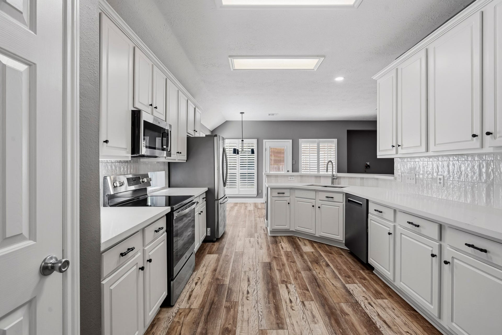 3622 Pedernales Trails Lane, Katy, TX 77450 Updated kitchen with excellent storage, quartz counters, new hardware and fixtures, recent appliances and designer backsplash.