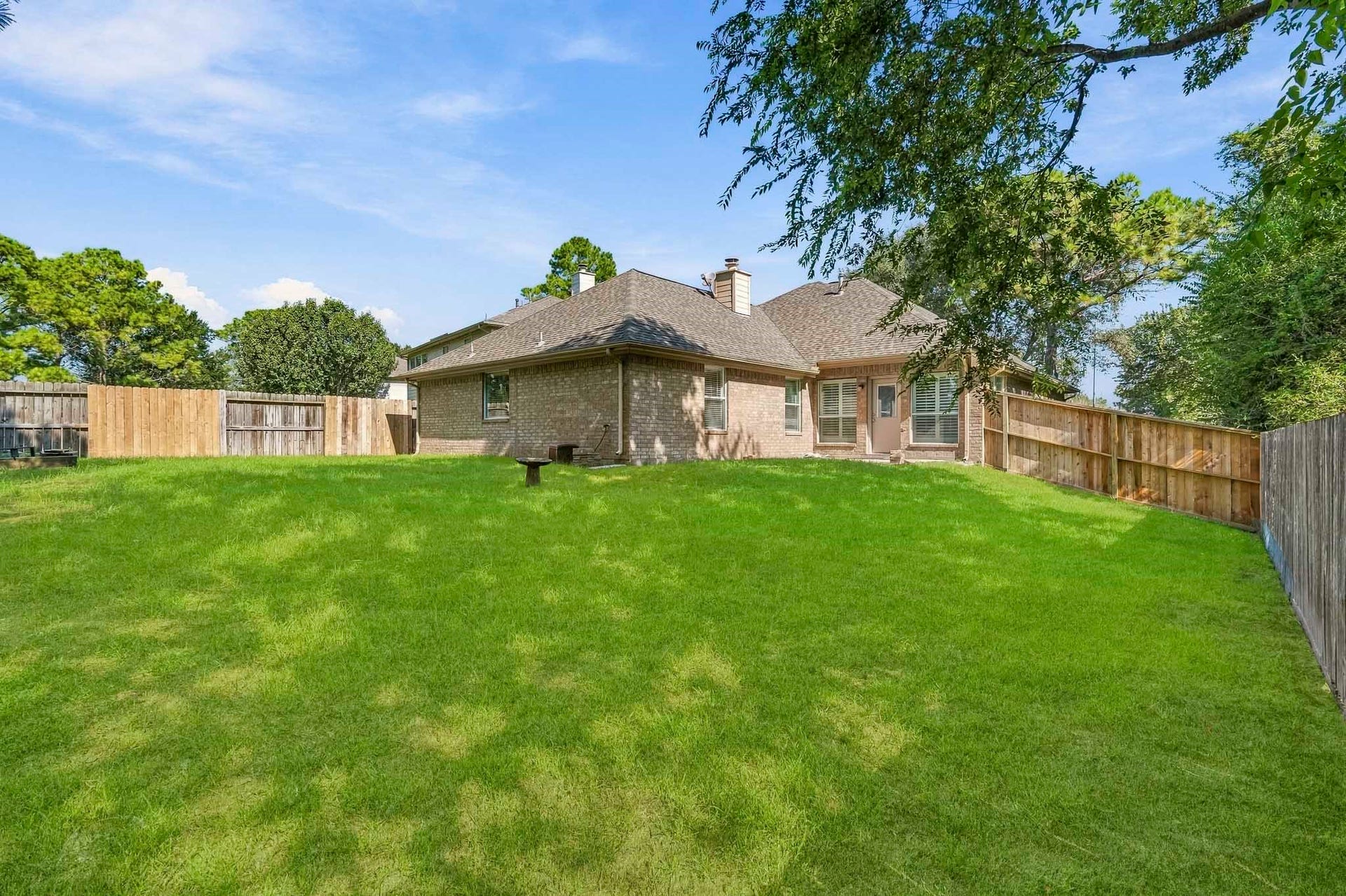 3622 Pedernales Trails Lane, Katy, TX 77450 Large backyard, which slopes away from the home with private access to George Bush park area and no neighbors on 2 sides.