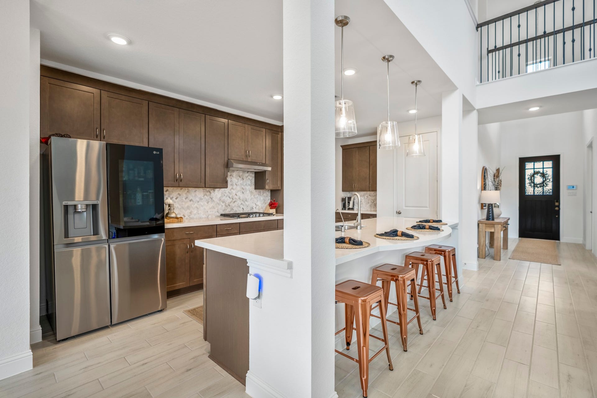 21723 Cordia Trace, Cypress, TX 77433 Look at all that cabinetry! Storage stretches throughout the kitchen while the open layout keeps the cook connected to everything happening in the surrounding living spaces.