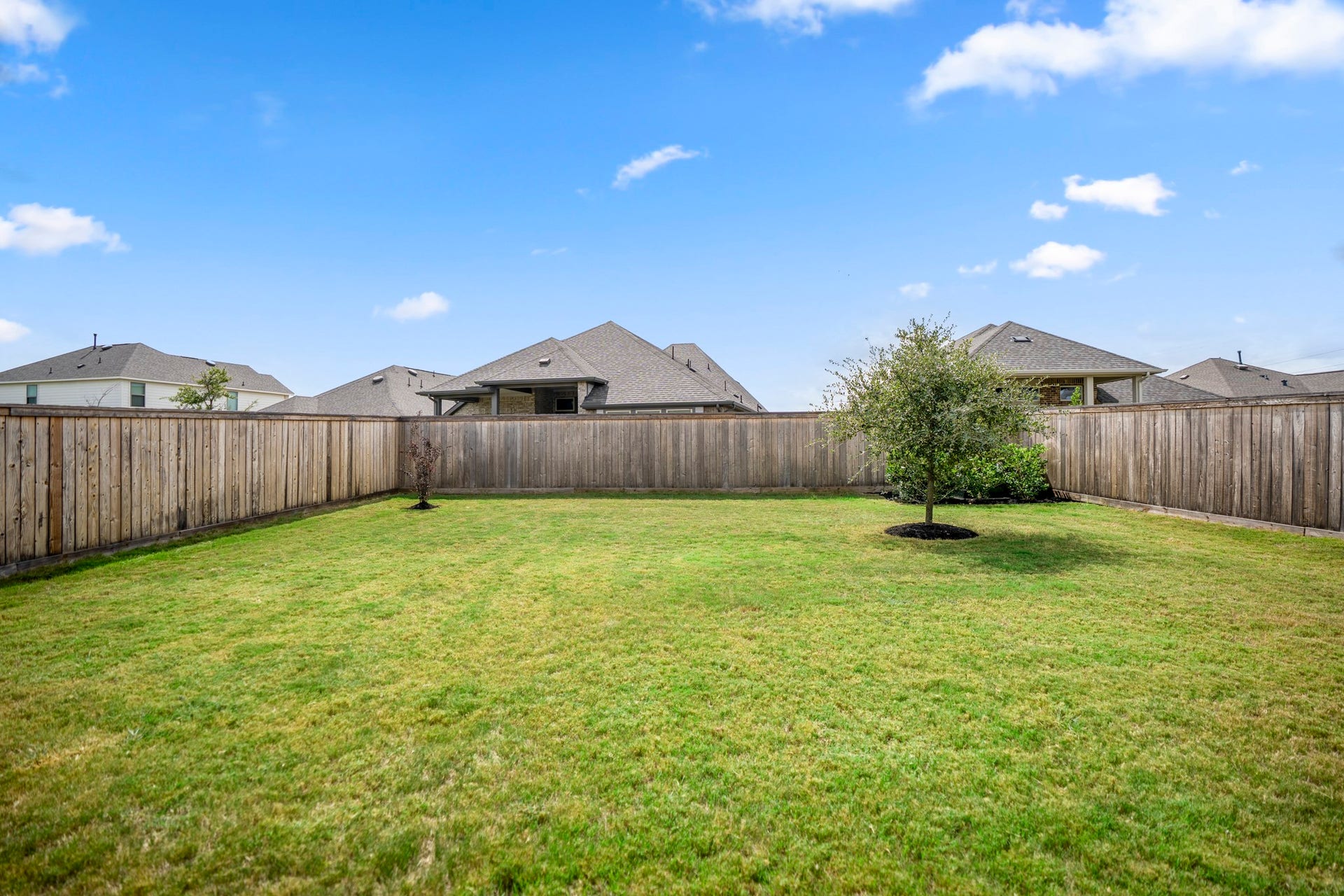 21723 Cordia Trace, Cypress, TX 77433 This angle really shows the depth of the yard. The 50-foot lot gives you usable outdoor space instead of leaving the covered patio pressed against the back fence.