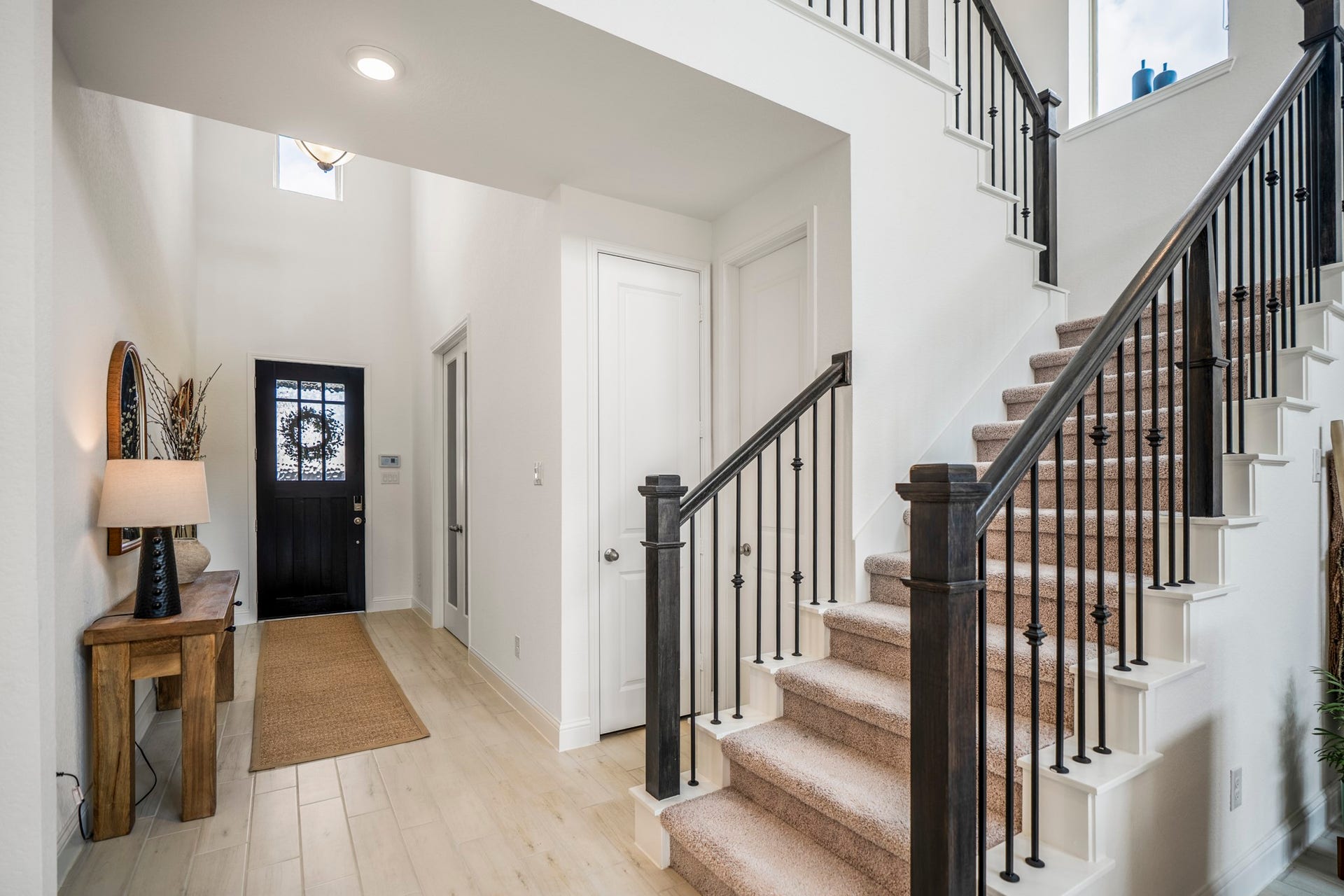 21723 Cordia Trace, Cypress, TX 77433 Follow the staircase upstairs and the home's vertical architecture becomes even more noticeable. The open railing keeps the transition light and connected to the spaces below.