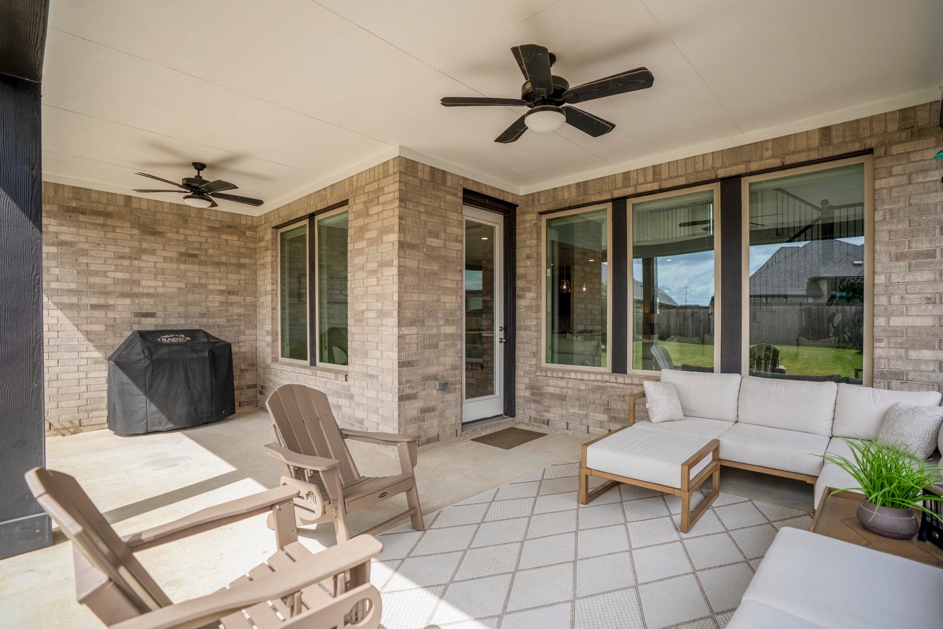 21723 Cordia Trace, Cypress, TX 77433 Now THIS is an outdoor living space. The extended covered patio gives you a substantial shaded area for dining, lounging and entertaining without sacrificing the backyard beyond it.
