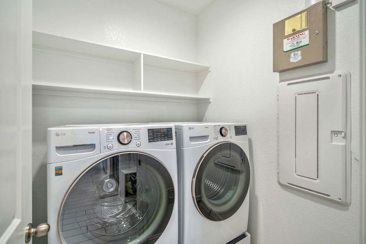 21723 Cordia Trace, Cypress, TX 77433 Even the laundry setup comes with an upgrade! The LG front-load washer and dryer with bottom storage are included, giving the next owner a move-in-ready laundry space from day one.