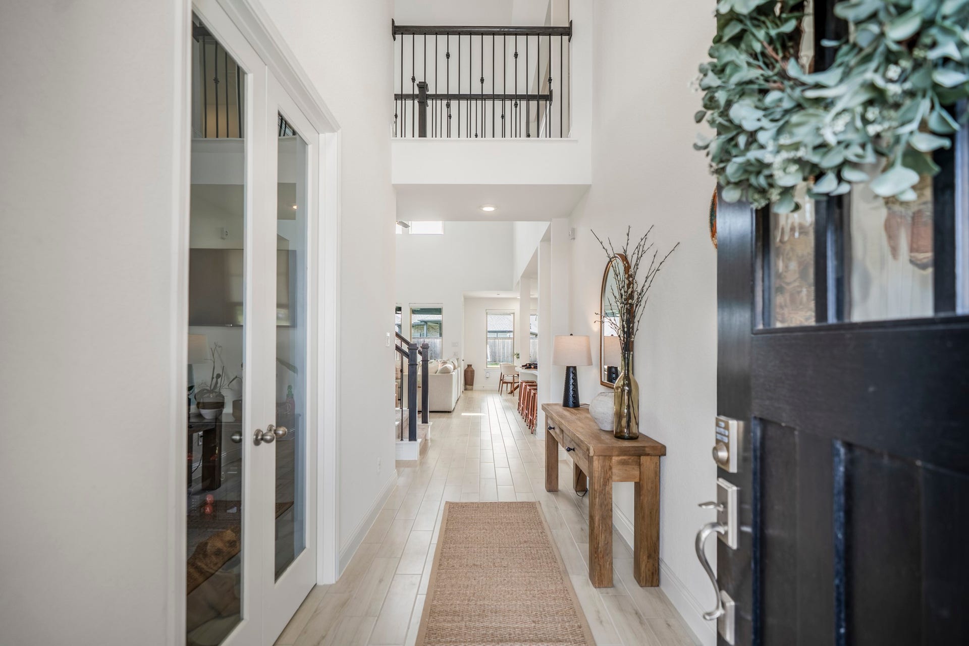 21723 Cordia Trace, Cypress, TX 77433 Step through the front door and your eye immediately travels upward. The tall ceiling, staircase and open sightline toward the main living area give you that first hint that this home is going to feel much larger than expected.