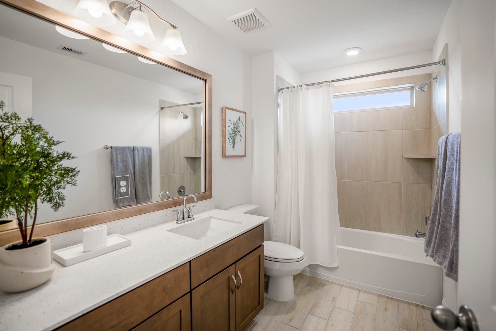 21723 Cordia Trace, Cypress, TX 77433 The upstairs full bath serves the secondary bedrooms with a practical layout and plenty of vanity space for busy mornings.