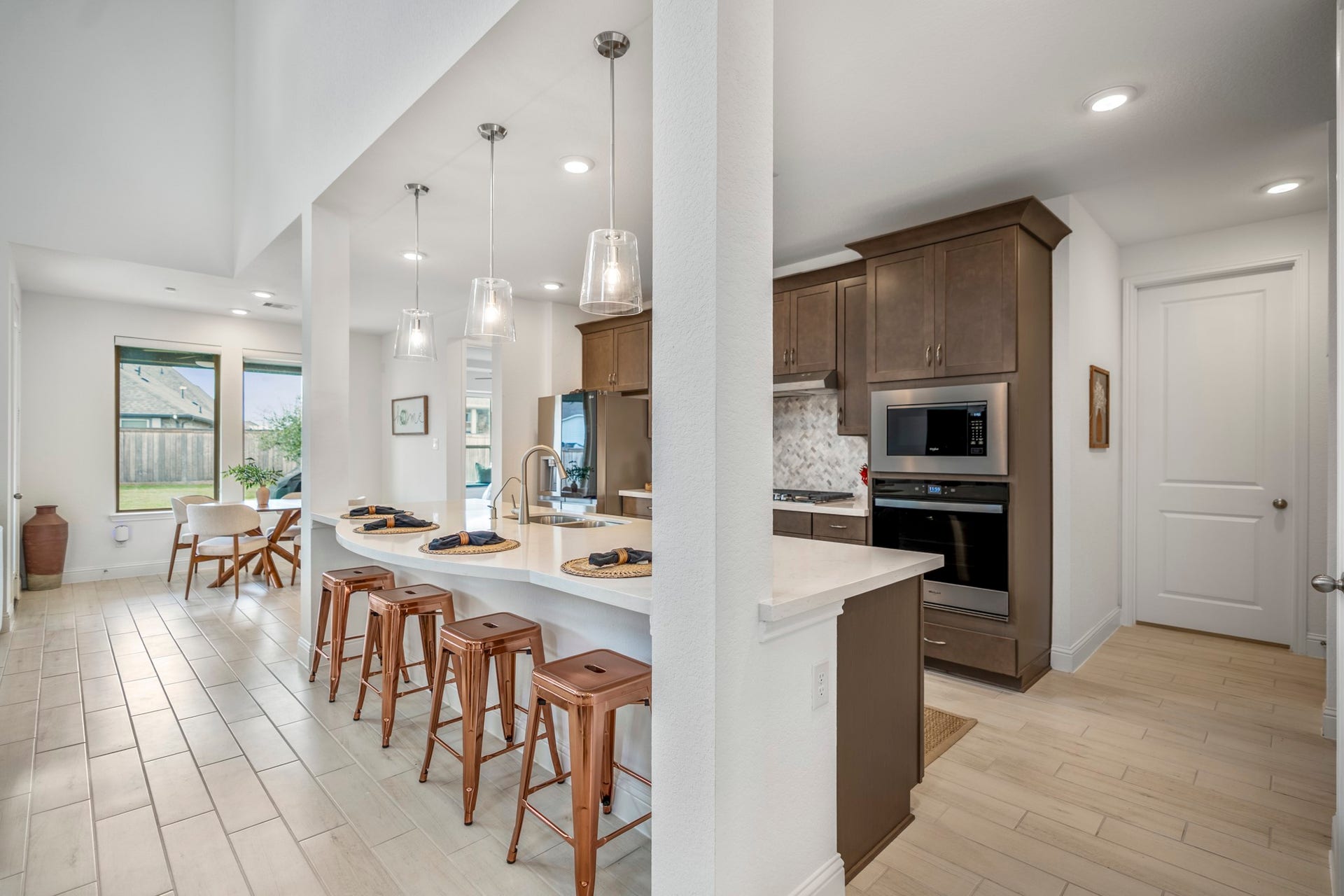 21723 Cordia Trace, Cypress, TX 77433 The generous island gives you plenty of prep space along with casual seating for quick breakfasts, homework or conversations while dinner is coming together.