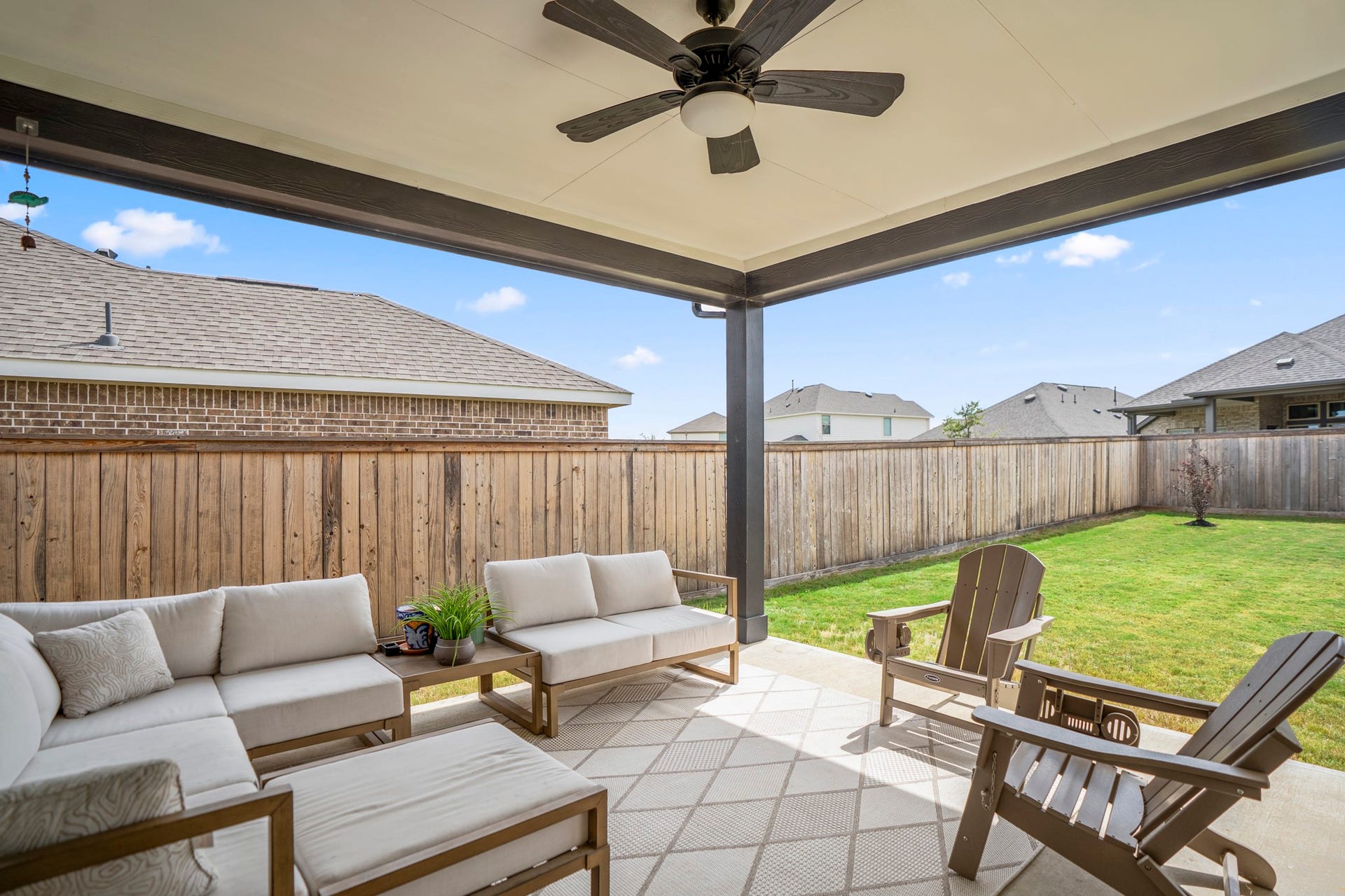 21723 Cordia Trace, Cypress, TX 77433 Ceiling fans keep air moving overhead while the covered design makes this a space you'll actually use through much of the year.