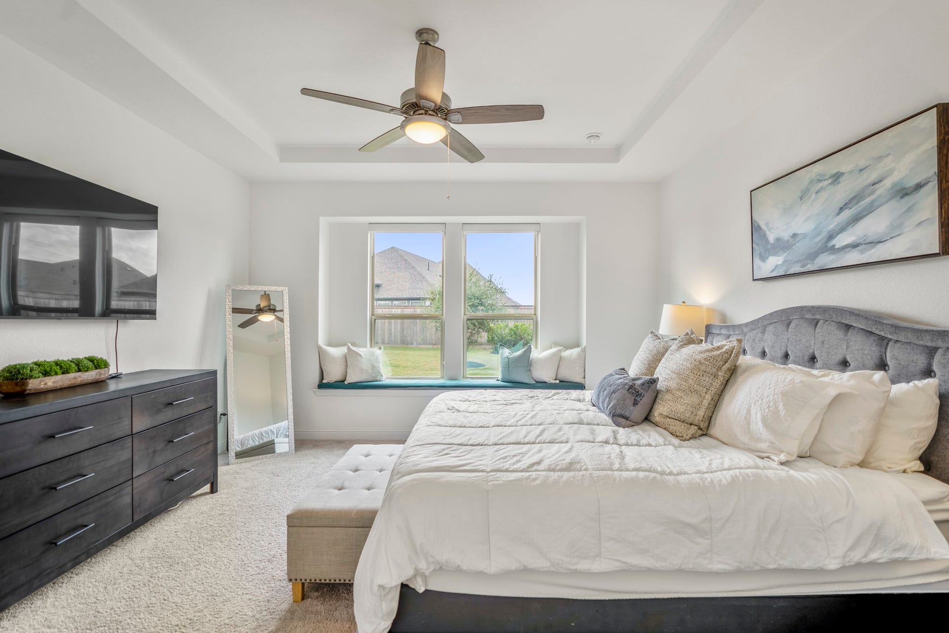 21723 Cordia Trace, Cypress, TX 77433 This is such a sweet detail. The built-in window seat creates a cozy little spot for reading, relaxing or simply enjoying the natural light. The window bench and tray ceiling were builder upgrades selected for the primary suite.