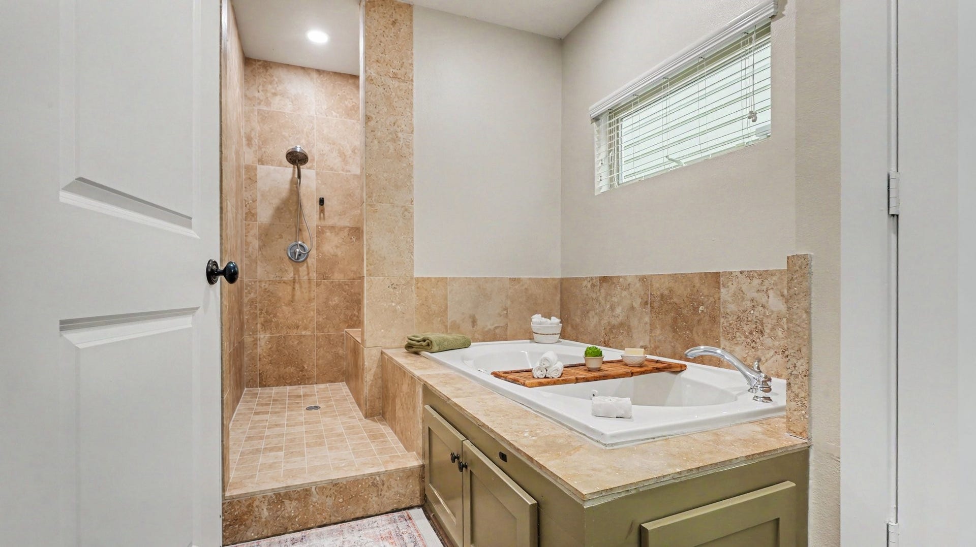 Relax in the spa-like jetted tub or walk right into this spacious shower