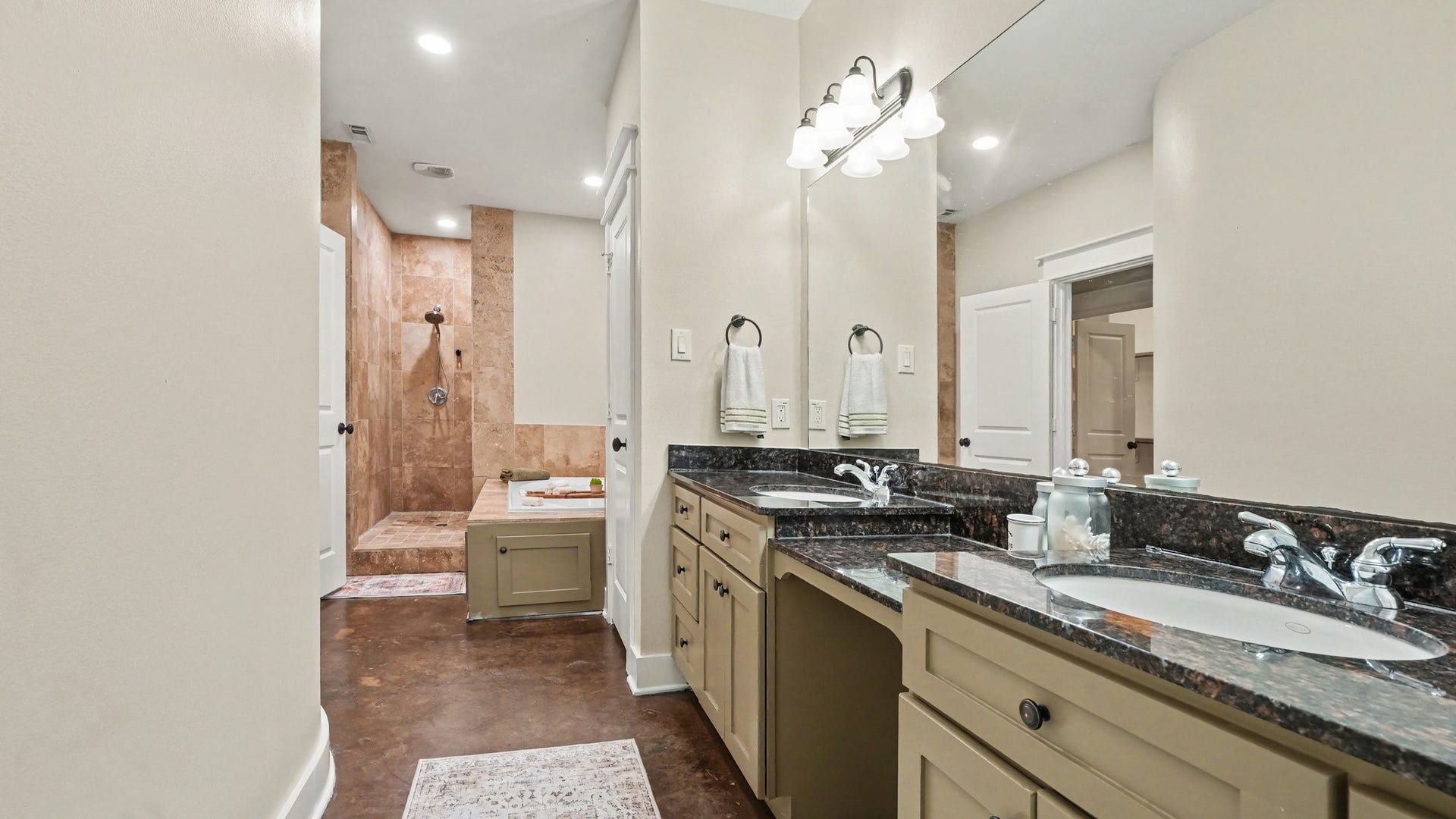 Primary ensuite bathroom with dual sinks, jetted tub and fabulous walk in shower