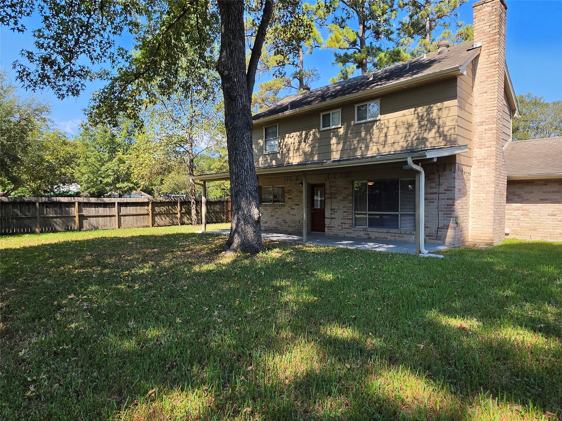 Another view of the backyard & large covered patio.